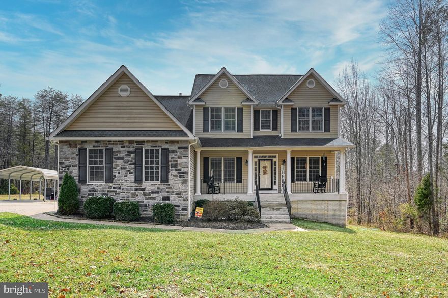 Nestled on a serene 2-acre lot, this exquisite Colonial-style residence offers a harmonious blend of luxury and comfort, perfect for those seeking an exclusive lifestyle. Built in 2012, this stunning home boasts 5 spacious bedrooms and 4 elegantly appointed bathrooms, providing ample space for relaxation and entertainment. Step inside to discover a warm and inviting interior, where high-end finishes and thoughtful design elements create an atmosphere of sophistication. The main living areas feature a combination of plush carpeting, rich wood flooring, and stylish ceramic tile, ensuring both beauty and durability. Elegant chair railings accentuate the walls, while double-pane bay windows invite natural light to fill the space, enhancing the home's welcoming ambiance. The heart of the home is undoubtedly the gourmet kitchen, equipped with top-of-the-line appliances, including a double oven, cooktop, and refrigerator with an icemaker. Upgraded countertops provide a luxurious touch, making this space perfect for culinary enthusiasts and entertaining guests alike. The adjoining dining area flows seamlessly into the living room, where a cozy gas fireplace serves as a focal point, creating a perfect setting for intimate gatherings. Retreat to the primary suite, a true sanctuary featuring a lavish en-suite bathroom designed for relaxation. With its upgraded finishes and thoughtful layout, this space offers a private escape from the world. The fully finished walkout basement adds even more versatility, providing additional living space that can be tailored to your needs. Step outside to your own personal oasis, where a stunning saltwater pool awaits. Surrounded by lush landscaping and mature trees, this outdoor space is perfect for summer gatherings or quiet evenings under the stars. The screened porch and patio areas offer additional spots to unwind, while flood lights ensure safety and ambiance during nighttime enjoyment. The property also features a side-entry attached garage with ample space for three vehicles, complemented by a gravel driveway that enhances the home's curb appeal. With its secluded setting and picturesque views of the surrounding woods, this residence offers a tranquil retreat while still being conveniently located to local amenities. Experience the perfect blend of luxury and comfort in this remarkable home, where every detail has been thoughtfully curated to create an inviting and sophisticated living environment.