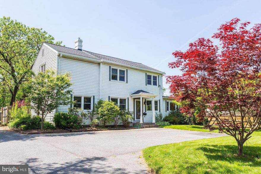 Beautifully renovated colonial with awesome enclosed green landscaped yard with privacy fence. Beautiful hardwood floors throughout.  Amazing renovated modern kitchen with granite countertops, top-of-the-line stainless steel appliances, plenty of custom cabinets and eat-in breakfast area. Formal dining opens to kitchen. Spacious and open family/living room with gas fireplace and french doors opening to inviting outdoor patio area and spacious and green fenced backyard. Main floor bedroom and full bath. Upper level boasts 4 bedrooms and 2 full baths which includes the wonderful master suite with master bathroom and walk-in closet. One bedroom converted to huge master closet can be easily converted back to 4th upstairs bedroom.  Finished basement includes recreation & family room space, laundry area and storage. And, large wrap around paved driveway for ample parking!