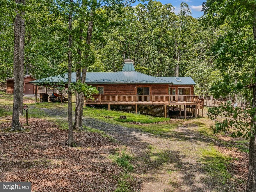 2 BR contemporary rancher style home in River Ridge that has been lovingly maintained.    Offering home fully furnished including the kayaks and complete with the outside sauna!  Relax on the back deck and enjoy the surrounding nature.    Home is situate on 2 lots totaling 6.53 acres.  River Ridge is a gated community with a common area along the Sparkling Cacapon River.