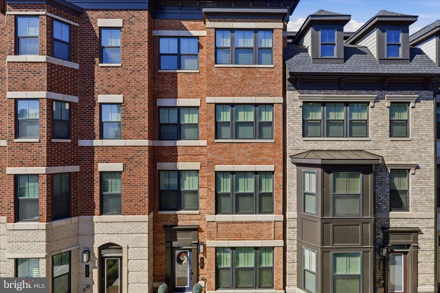 Welcome to 213 Market Sq NW, an exceptional residence in the heart of Vienna, VA, where sophisticated design meets an unbeatable location. Perfectly situated for a vibrant lifestyle, this home is just steps from the charming shops, restaurants, and local favorites of downtown Vienna, with immediate access to the beloved W&OD Trail. This home meticulously incorporates every premium upgrade offered by the developer and more, including a spacious 2-car garage equipped with a high speed EV charger. The main level is an entertainer's dream, featuring a living room with custom built-ins framing a cozy gas fireplace, and a dining room enhanced by a custom breakfast bar and integrated beverage fridge.The gourmet interior flows effortlessly to a covered outdoor balcony off the kitchen, which features a built-in gas fireplace and TV hookup for year round enjoyment. For the ultimate open air experience, the rooftop deck serves as the home’s crown jewel, complete with built in speakers and  with water and electrical hookups. Comfort is guaranteed with four spacious bedrooms, each boasting its own private ensuite bath and custom closets, offering unparalleled privacy for residents and guests alike.This residence is as smart as it is stylish, fully wired with Ethernet and dedicated access points on every floor for seamless, high speed connectivity. A multi zone Klipsch and Sonos speaker system flows throughout the home, allowing you to set the perfect ambiance in every room. Offering the rare combination of turn key luxury and technology forward living in a premier walkable community, 213 Market Sq NW is a truly unique opportunity to experience the very best of Town Center living.