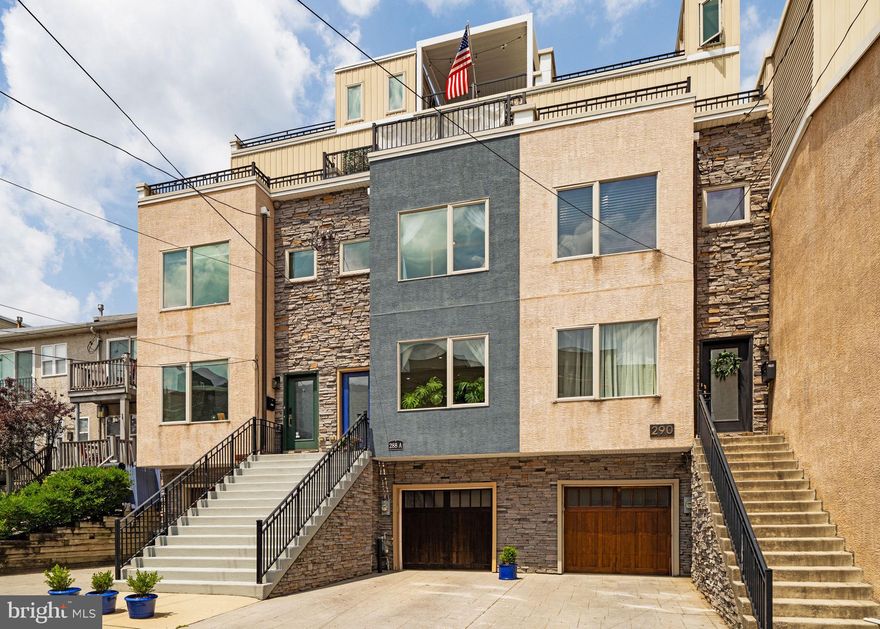 Manayunk Townhome with Private Elevator, Garage plus driveway parking, & Rooftop Oasis

Welcome to 288A Delmar Street, a truly exceptional and meticulously maintained townhome on a quiet street in Manayunk. This 3-bedroom, 3.5-bath home is filled with thoughtful upgrades and standout features—including a private elevator and garage plus driveway parking.

Starting at the top, the crown jewel of this home is the rooftop oasis, thoughtfully designed for year-round enjoyment with a motorized pergola, gas fire pit, and breathtaking panoramic views of the Philadelphia skyline—a perfect spot to watch sunsets or entertain above the treetops. Gas, electric and water hook ups are ready to go.

The expansive primary suite offers two large closets, a flexible bonus space, and an electric fireplace for cozy evenings. Glass french doors lead to a private balcony perfect for morning coffee or quiet reading. All bathrooms in the home are equipped with luxurious high-end Toto toilets, adding a spa-like feel to daily routines.

On the second level, you'll find two bright and airy bedrooms, including one with an ensuite full bathroom, while a second full bath is conveniently located off the hallway. This level also includes a large walk-in laundry room with ample storage and functionality.

The main level features an open layout with a half bath and a chef’s kitchen outfitted with KitchenAid appliances, a mini beverage fridge, and a large island ideal for entertaining. Glass French doors open to a rear yard with lush, mature gardens—your own private green retreat.

Tucked away in the serene privacy of the basement, a spa-like soaking tub (or cold plunge!) room offers the ultimate retreat—perfect for unwinding in peace after a long day.
Also found at the lower level, a generously sized egress area offering a rare outdoor extension—ideal for gardening or other outdoor hobbies. Through the garage, you'll find an additional large storage room.

Located just steps from Gorgas Park and Germany Hill, and within walking distance to SEPTA Regional Rail, this home offers quick access to Center City while keeping you connected to nature and the charm of Manayunk.