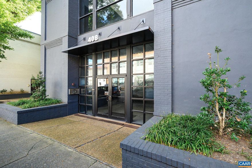 Rare Opportunity to Own a Downtown Condo, in the well located Maclin Building with Mountain Views. Enjoy the views from the top floor, while entertaining, both inside and on the spacious terrace. The floor-to-ceiling windows create a bright dining area and living room. The living room features a gas fireplace with a copper surround and a large built-in bookcase. The galley kitchen is equipped with granite countertops and stainless steel appliances. Terrace access through sliding glass doors from either the living room or the primary bedroom. The Terrace can be enclosed to create a year-round Sunroom.  The primary bedroom offers two spacious closets, and the adjoining full bath includes a dressing area.  The second bedroom is a versatile space that can serve as a den or study. Custom-designed cherry bookshelves, drawers, and cabinets are featured throughout. Laundry closet with a stacked washer and dryer.  Fresh paint and new carpet make this condo "move-in ready." The condo association fees cover a parking space in Market Street Garage, water, natural gas, building maintenance, and additional storage.,Fireplace in Living Room