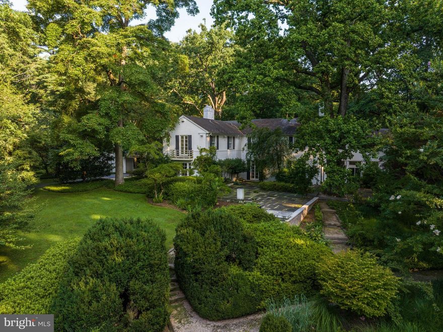 Live authentically.  Timberlane. Perched gracefully on a gentle slope on the western side of Park Heights Avenue. Nestled within over 14 acres of secluded, idyllic park-style grounds, this estate offers unparalleled privacy. 

Meandering amidst the towering trees and ascending the hill, the driveway unveils a glimpse of the two grand vintage carriage houses. Immense, regal specimen trees cast their shade over the sprawling lawns and gardens, creating an enchanting backdrop. Porte-cochère and a sheltered loggia stand ready, guiding visitors and extending a warm invitation to the front door.

Originally home to a family of art collectors, Timberlane was built for entertaining and housing the family’s world-renowned art collection. Timberlane’s gardens originally showcased the collection and were the architectural model for a local museum's Sculpture Garden.  

Aside from housing the collection, Timberlane's exquisite gardens and terraces play host to majestic specimen hardwood and softwood trees, alongside an array of rare, mature plants, and shrubbery. The vast expanse of bluestone flagstones gracefully envelops the residence, creating numerous expansive areas and serene retreats.

Positioned thoughtfully on a southeastern incline, the pool and its accompanying pool house were meticulously placed to embrace the most sun-kissed locale, ensuring an ideal blend of aquatic enjoyment and garden splendor. The pool house boasts an inviting timber-framed cathedral ceiling, a covered seating area, a fully equipped galley kitchen, and a convenient three-quarter bath.

The property gains its old-world charm from the presence of two spacious outbuildings, each standing on a separately deeded parcel. The first is a 45'x24' frame barn that features a charming three-bedroom, two-bathroom apartment on its second floor. The second outbuilding mirrors the same shape and style, presenting a sizable garage with a substantial room above, complete with a cement floor.

The main house of Timberlane was designed and built by Palmer & Lamdin in 1940 using the finest materials and craftsmanship throughout.  The original specification manual from 1939 listing all materials and workmanship to be employed in Timberlane’s construction from foundation stone to slate roofing is still in existence and transfers with the property along with two original architectural renderings.  

The rambling light grey painted brick structure with slate roof is a mid-century modern style masterpiece – both commanding and formal but welcoming and relaxed at the same time.  An entertainer’s dream for either small or large gatherings, indoor or outdoor, formal or informal Timberlane was built to accommodate and endure.  

This property is comprised of two separate tax ID numbers and has the potential for three separately deeded residences. See uploaded plan. Potential for donation as well.  You will find Timberlane directly across from Anton North and neighboring Leisure Hill Drive. Cultivate your existence. Please book your appointment now. In the event the active date changes, you will be notified. The art of uniting human and home. Private drive please do not visit without an appointment. Roof is original with minor repairs over the years- it's slate. Major systems are approximately 8-10 years old, just serviced. Water softening system is 3years old.