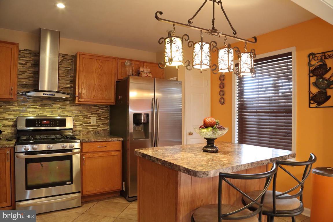 Stunning town home in Lancaster Township! Impressive renovation boasting an open floor plan, kitchen island, custom tile flooring and bathrooms throughout. This home offers a professionally finished basement with a custom stone face bar and granite counter tops along with a fourth bedroom with it's private full bath. This home is extremely unique.