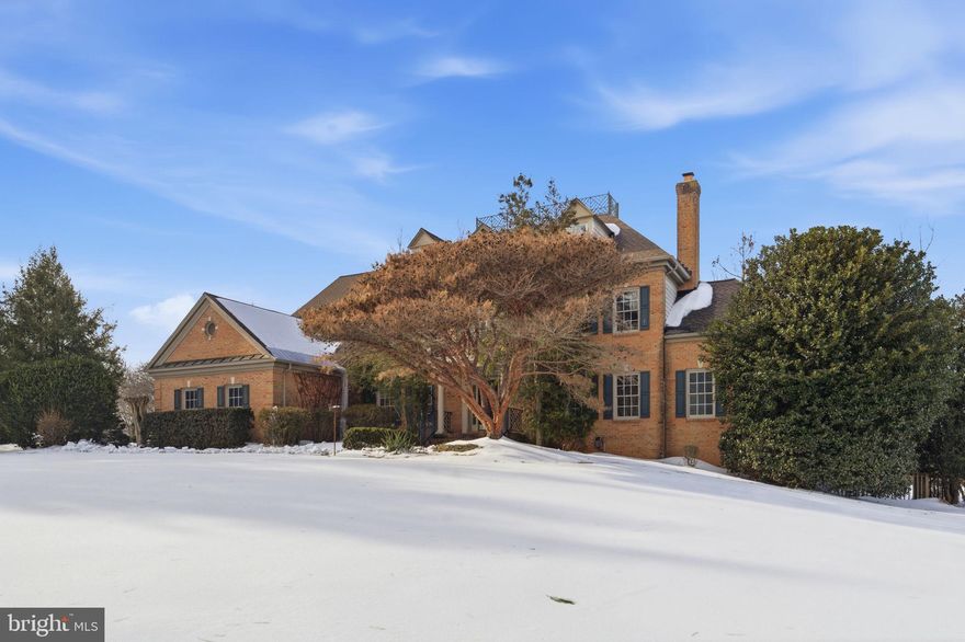 Exceptional Great Falls estate offers nearly 8,000 square feet of timeless brick colonial architecture on just over two private acres, a combination that is increasingly rare in today’s low-inventory luxury market. The setting is serene and beautiful, highlighted by a stunning rectangular heated pool and spa with a flagstone patio and pool deck that creates a true resort-style experience at home.
The home opens to a generous foyer, where a sweeping hardwood staircase creates a sense of arrival and timeless architectural presence, featuring refinished hardwood floors throughout the main and upper levels, brand new paint across the entire home, and a floor plan that is both gracious and highly functional. Nine-foot ceilings, vaulted ceilings and cathedral ceilings enhance the sense of style and space, while abundant natural light fills every room.
The kitchen serves as the heart of the home, with gas cooking, granite countertops, Bosch dishwasher, a three door refrigerator, walk in pantry and seamless flow to the morning room, 2 story family room with raised brick hearth fireplace and expansive  deck. Kitchen island and table space. These areas provide multiple vantage points overlooking the private fenced backyard, spa and pool. The conveniently accessed 3 car garage and laundry room, just off the kitchen, add ease to daily routines. Exterior side door from laundry room. New asphalt driveway.
The main level includes a private office, formal living and dining rooms, sunroom.
Upstairs are four generously sized bedrooms with crisp white bathrooms, each thoughtfully connected for comfort and privacy. Closet systems throughout the home reflect careful attention to organization. The primary suite is expansive and serene, with walk in closet systems, dressing room space offers a spa-like atmosphere.
The walkout lower level extends the living space beautifully. Featuring an expansive fitness studio with  an infrared sauna, equipment and bamboo flooring. The fifth bedroom and full bath are above ground and light-filled, located just off the lower-level recreation room and gas fireplace, provide ideal accommodations for guests, extended family, or an au pair.
Large double storage rooms with built in shelving.
This home delivers classic Great Falls elegance, modern livability, and true turnkey condition in one of the area’s most sought-after locations. It is refined without being pretentious and expansive without feeling overwhelming.