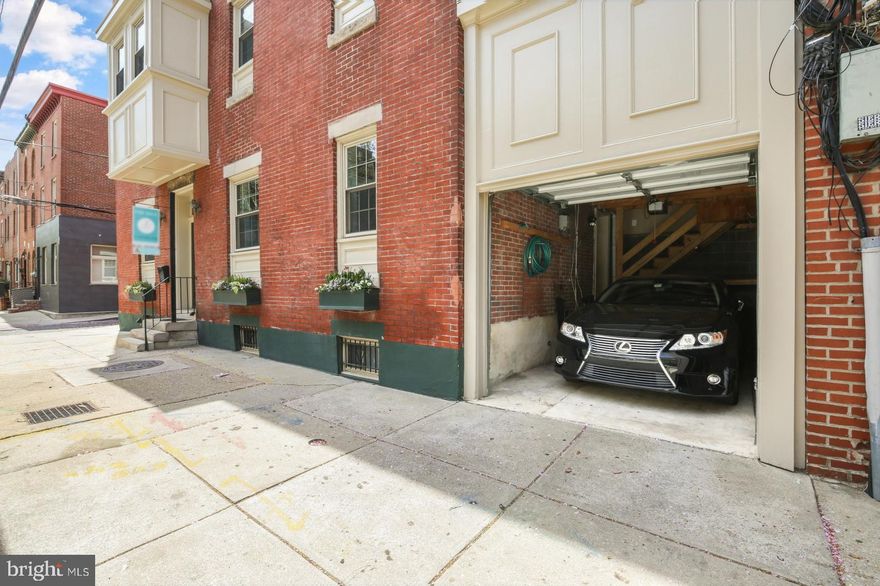 You can HAVE IT ALL in an AMAZING LOCATION! Corner property with ATTACHED GARAGE, a private side DECK, huge FINISHED BASEMENT, high ceilings, elegant CROWN MOLDINGS, hardwood floors, central air, and nearly 2800 SQ FT of finished living space located where the edges of Rittenhouse Square, Fitler Square, and Graduate Hospital meet. This 4BR (+ nursery/office) / 3.5BA gem in the Greenfield School Catchment features windows on three sides for tons of light throughout. Step into the entrance foyer with coat closet and immediately notice the character and charm of the pocket doors on either side of you. The spacious living room offers custom built-in shelving and cabinetry, a wood-burning fireplace, crown moldings, high ceilings, recessed lighting, two large windows, closet, and a powder room. Off the living room and up a short flight of stairs is a private side deck where you can entertain, BBQ, or just relax. Opposite the living room is the eat-in kitchen with granite countertops, oversized cabinets, stainless steel appliances, high ceilings, and tons of natural light. On the second level, you'll find a spacious ensuite bedroom with a large walk-in closet with custom-shelving, and a bathroom with Carrera marble stall shower. Also on the second level is a gorgeous bay window with space for a seating area, and an additional bedroom and another bright, full bathroom. The third level features another ensuite bedroom with two, large walk-in closets with custom shelving, a full bathroom with marble floors and subway-tiled shower/bathtub, and views of the skyline. Across the hall, there's a nice-sized fourth bedroom and a smaller nursery/home office. [The door to the third level sets the stage to make the entire third floor a show-stopping primary suite with one of the bedrooms becoming  a grand primary bathroom.] The basement was thoughtfully and meticulously finished to add 400+ SF of additional living space, perfect for a playroom, a second living room, or home gym. The basement also has additional storage space and newer laundry and mechanicals. Walking score: 99. Biking score: 100.  Just steps away from Sabrina's Cafe, Social House Cafe, Doggie Style, City Fitness gym, CVS, boutique grocery stores, and countless restaurants, cafes, and pubs! A few short blocks to Rittenhouse Square Park, Fitler Square Park, Schuylkill Banks park with running trails, dog park, playgrounds, and much more. Very convenient to public transportation, as well as hospitals (HUP, CHOP, Jefferson) and universities (Penn and Drexel). This won't last long--schedule your tour today!