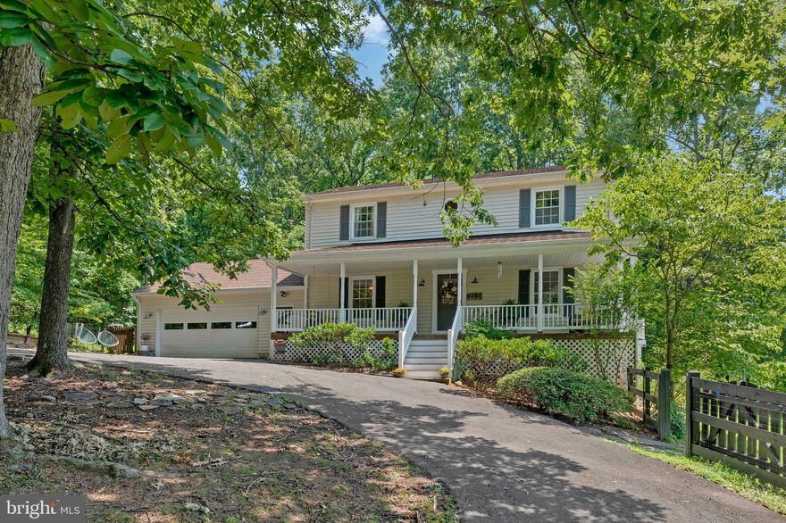 You will not want to miss this amazing opportunity in Broad Run minutes to Gainesville. Beautiful front porch. This amazing home sits on almost 2 acres zoned agricultural with 1.13 acres the property fully fenced in, plus smaller additional fenced area behind garage. Perfect if you want to have animals, chickens or just let your pets and family enjoy the outdoors. Main level features hardwood floors, living room, dining room, family room with wood burning fireplace, sunroom, half bath and updated kitchen. Kitchen features stainless steel appliances and white cabinets. Upper level features 3 bedroom and 2 full baths.  Primary bedroom with fireplace. Finished lower level walk out features 4th bedroom, full bathroom, laundry room, and family room. So many places to enjoy the outdoors from the front porch to the screened in porch, to the deck with hot tub or sitting around the fire pit. 2 car garage. Circular driveway for 8 cars and additional parking for additional vehicles. Metal shingle roof for many years of care free maintenance. NO HOA. Come fall in love.