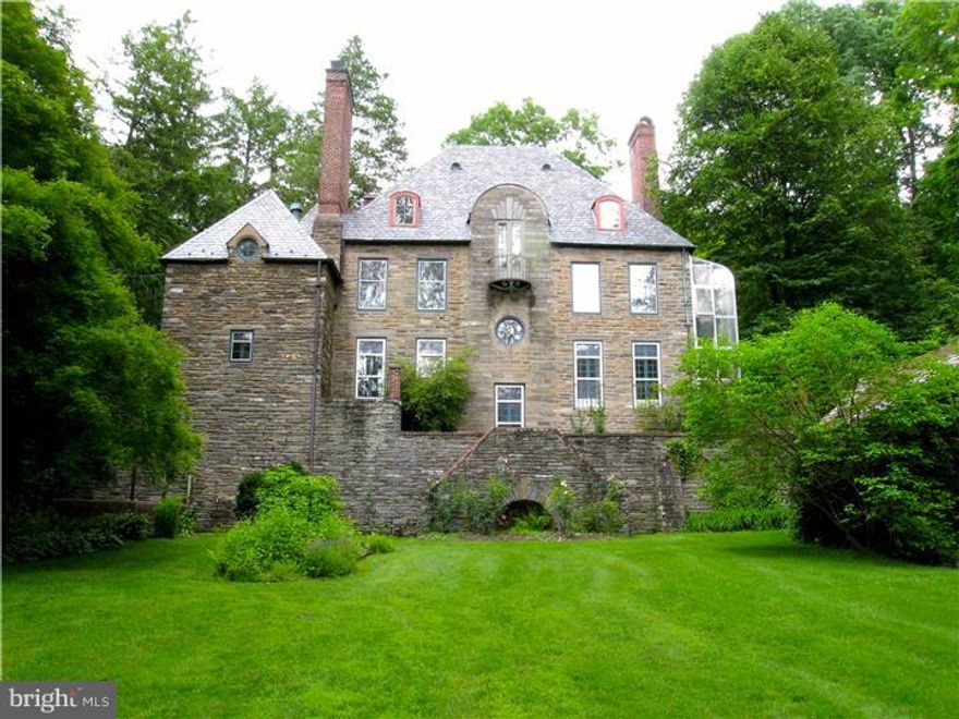Sophistication and comfort.  Remarkably beautiful 1919 stone manor house on 2.5 acres abutting park and the Wissahickon Creek.  Designed by world-renowned architect and Chestnut Hill resident George Howe with the romanticism and French-Italian spirit of Howe's High Hollow above it on Hampton Road but with more defined architectural idea of "human necessity" so the floor plan is marvelously functional--even in today's world.  The whole house is on a human scale.  No energy wasting cathedral ceilings here!  Most rooms face the southern sun.  Big functional cook's kitchen with marble island/5 burner gas cooktop/electric wall ovens/Sub-Zero refrig-freezer/abundant counter and storage cabinets/kitchen garden, 1st floor powder room, stunning LR and DR with wood-burning fireplaces, quiet book-shelf-lined library, master BR suite with to-die-for master bath and great closets, 2-story green house added by previous owner.  Yellin iron work.  Lower level family rm/gym w/sauna. Outbuildings conveyed as-is including stables with attached garage, carriage house with 2-car garage and studio apt above, rustic stone spring house. Stone-paved courtyard. Sweet private patio. Fertile gardens and sweeping lawns that go all the way to the park.  Property fenced for privacy.  Many upgrades throughout. Direct entry into the park makes this property paradise for naturalist/gardener/fisherman/hiker.