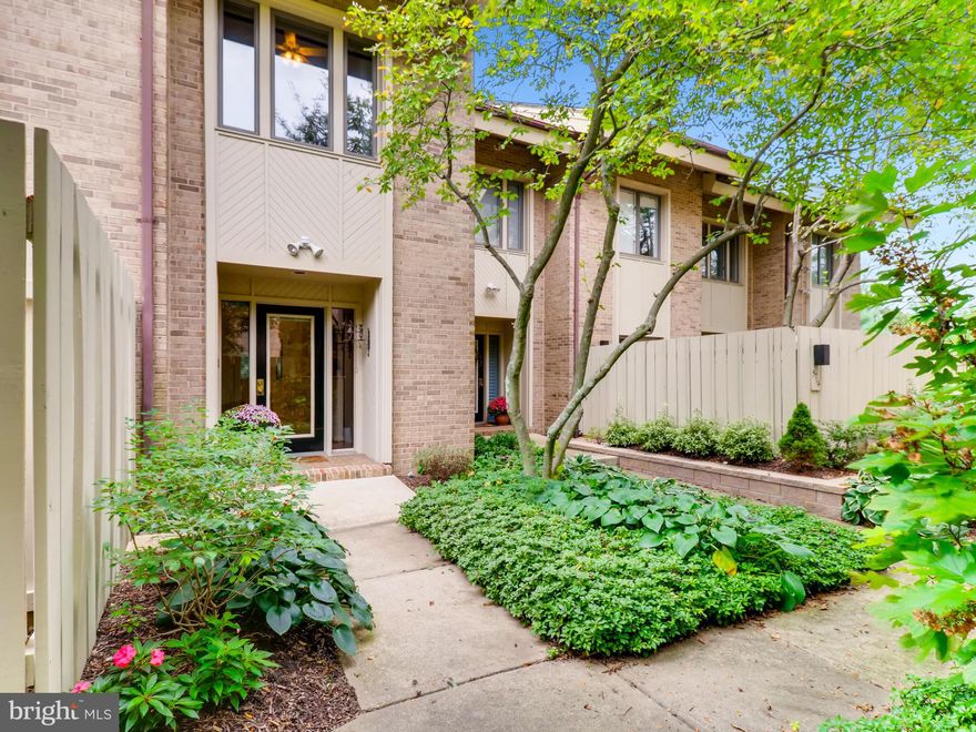 Meticulously maintained twnhse w/light-filled open spaces perfect for entertaining. Hi ceilings, solid oak hrdwd flooring, wdburn FP. MBR w/ensuite BA, wlk-in clset & balcony. Expansive loft ofc/BR & fin bsemnt. Private grden patio; lg entertainment dck in quiet location w/views of greenspace. Lg 2Car Gar. HOA provides services galore + water. Walk to schools. Minutes to MetroBMore. Simplify life!