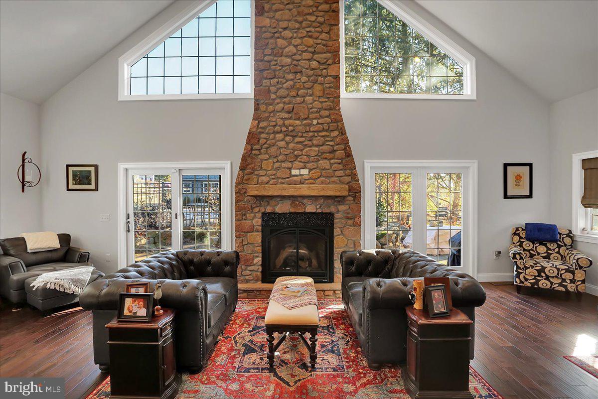 Exquisite Custom-Built Southwest-Style Chalet – A Luxurious Retreat! Discover a seamless blend of modern luxury and timeless charm in this exceptional Southwest-style chalet. The striking exterior, featuring an impressive 80-foot front porch adorned with handcrafted blacksmith-forged iron railings, warmly welcomes you into a home radiating elegance and warmth.
As you step inside, be enchanted by the expansive, sunlit great room, the perfect gathering place for family and friends. This inviting space showcases a stunning stone fireplace built from the foundation of a 19th-century candy factory and a breathtaking oak staircase with custom-forged railings, creating an atmosphere of sophistication. Cozy evenings await by the welcoming gas fireplace, making this an ideal setting for relaxation. Elegant Lancaster barn beams throughout the first floor add rustic character and charm to the home's design.
The gourmet kitchen, truly the heart of the home, is every chef's dream. It boasts top-of-the-line Viking appliances, gorgeous granite countertops, and 34 custom birch cabinets that provide ample storage for all your cooking needs. Enjoy the luxurious comfort of heated floors, a double oven, and a professional-grade six-burner gas cooktop that will elevate your culinary experiences. The thoughtfully designed layout also includes a spacious laundry room with 20 custom birch cabinets and an oversized pantry, ensuring organization and efficiency for effortless living.
The first floor further delights with a lovely living room featuring built-in benches, perfect for unwinding in comfort. An elegant dining area with built-in seating and generous storage makes it ideal for both casual meals and formal gatherings. Additionally, you’ll find two spacious bedrooms, each filled with natural light and equipped with oversized closets, complemented by a beautifully appointed full bath. An additional staircase in the west wing enhances the flow and accessibility throughout the home.
Ascend to the lavish primary suite on the second floor, where relaxation meets opulence. This exceptional retreat offers his-and-hers bathrooms, a rejuvenating tile steam shower, and a jetted soaking tub. Step out onto your private veranda to enjoy peaceful views of the serene backyard and lush woods.
The versatile upper floor features a large sitting room that can effortlessly serve as an additional bedroom, office, or cozy retreat. The beautifully finished basement, with 9-foot ceilings and an impressive 80-foot length, is ready for your personal touches, providing an ideal space for a home theater or game room. An additional fireplace in this space adds further warmth and charm, making it a cozy gathering spot.
Above the oversized garage, a spacious 24x24 bonus room awaits your creative vision—perfect for a guest suite or home office.
Step outside into your personal backyard oasis, featuring a sparkling inground pool surrounded by elegant blue flagstone and impressive stone boulder walls, creating an idyllic outdoor retreat. Additional features include a whole-house generator, a superior wall foundation, and stylish sandstone tile in the kitchen.
This remarkable property presents a unique opportunity for discerning buyers. Don't delay schedule your appointment today for a private tour and take the first step toward making this luxurious retreat your forever home!