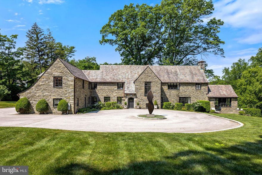 Welcome to one of the most prestigious streets in Lower Merion Township. This stunning fieldstone home with rich original details including the slate roof and leaded glass windows is beautifully positioned on 2.25 serene acres. 
Backing up to Saunders Wood Preserve you are surrounded by nature and privacy. Beyond the  entrance you will find the original random width hardwood floors throughout the first floor. This home has been carefully and thoughtfully renovated throughout sparing no expense or detail. 
The beautiful open kitchen with white cabinets has state of the art appliances including  a Viking Commercial grade stove with 6 burners and grill, double ovens, and a Subzero refrigerator/freezer. 
Off the Kitchen you'll find a Family Room/Breakfast Room addition with abundant natural light. First floor amenities include a Library/Study complete with built-ins and wet bar, Formal living Room with windows on two exposures along with an Office/Conservatory with vaulted wood beamed ceilings, Dining Room overlooking front and rear grounds complete this spacious level. 
The second level has a sumptuous primary suite, two walk in closets and spa like marble bathroom with soaking tub, walk-in shower and radiant heated floors. You will also find  an additional 4 bedrooms and 3 full baths on the second floor. The third level features two bonus rooms and a renovated full bathroom , which could easily be used as a Au-pair suite, office or play room . The beautifully finished walk-out lower level has an entertainment room, Gym and half bath. Minutes to the village of Gladwyne, downtown Bryn Mawr and downtown Philadelphia, Lower Merion Schools.