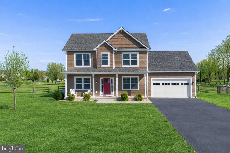 POOL IS OPEN + NEW PRICE—JUST IN TIME FOR SUMMER! Built in 2020 and set on a beautiful, flat 1.01-acre corner lot, this like-new colonial is ideally located in the highly sought-after Spring Mills School District, offering modern finishes, thoughtful design, and an outdoor lifestyle that truly sets it apart. Inside, the home feels warm, fresh, and effortlessly livable, featuring luxury vinyl plank flooring throughout the main level and decorative paneled walls that add texture, character, and a custom feel. The kitchen is both stylish and functional with gas cooking, a striking tile backsplash, abundant cabinet and prep space, and an oversized center island with seating—perfect for morning coffee, casual meals, or gathering with friends. The kitchen opens to a charming breakfast nook overlooking the backyard and flows seamlessly into the living room, creating a layout designed for connection and entertaining, while a formal dining area just off the kitchen provides additional flexibility for hosting. A main-level bedroom offers valuable versatility and works beautifully as a private home office, guest space, or flex room to fit your lifestyle. Custom-installed blinds and paneled doors throughout the home enhance the clean, move-in-ready feel. Upstairs, you’ll find three additional bedrooms and two full baths, including a spacious primary suite with tray ceiling detail, a spa-inspired bath featuring dual vanities, tile floors, a tiled shower, and a deep soaking tub, along with a walk-in closet. The additional bedrooms are generously sized, and the upper-level laundry is a true, separate laundry room complete with a front-loading washer and dryer that convey. The unfinished basement offers exceptional opportunity with a rough-in for an additional full bath and a walk-up exit to the backyard, allowing the next owner to bring their vision and unlock even more finished square footage over time. Outside is where this home truly comes to life. The lot is framed by split-rail fencing and anchored by a stunning 18x36 heated in-ground pool installed in 2023. The outdoor living space invites you to slow down and enjoy every season, with a heated pool, expansive patio, and open views that make it easy to entertain, unwind, or simply step outside and reset. It’s a space that feels equally suited for hosting and for everyday enjoyment. The pool is heated by an owned 500-gallon propane tank, which also services the gas cooktop, and an owned water softener adds long-term value. With a two-car attached garage, ample driveway parking, and a setting that blends space, style, and outdoor living, this North Ridge home offers a lifestyle that’s hard to replicate—modern, comfortable, and designed to be enjoyed both inside and out. Summer is calling—and this backyard is ready to answer!