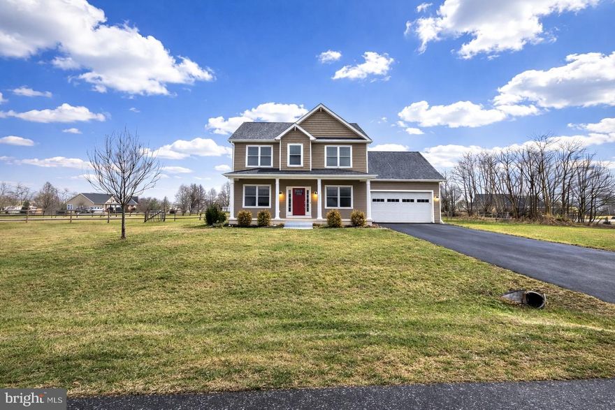 Welcome to Hilyard Circle—where everyday life feels like a retreat. Built in 2020 and set on a beautiful, flat 1.01-acre corner lot, this like-new colonial is ideally located in the highly sought-after Spring Mills School District, offering modern finishes, thoughtful design, and an outdoor lifestyle that truly sets it apart. Inside, the home feels warm, fresh, and effortlessly livable, featuring luxury vinyl plank flooring throughout the main level and decorative paneled walls that add texture, character, and a custom feel. The kitchen is both stylish and functional with gas cooking, a striking tile backsplash, abundant cabinet and prep space, and an oversized center island with seating—perfect for morning coffee, casual meals, or gathering with friends. The kitchen opens to a charming breakfast nook overlooking the backyard and flows seamlessly into the living room, creating a layout designed for connection and entertaining, while a formal dining area just off the kitchen provides additional flexibility for hosting. A main-level bedroom offers valuable versatility and works beautifully as a private home office, guest space, or flex room to fit your lifestyle. Custom-installed blinds and paneled doors throughout the home enhance the clean, move-in-ready feel. Upstairs, you’ll find three additional bedrooms and two full baths, including a spacious primary suite with tray ceiling detail, a spa-inspired bath featuring dual vanities, tile floors, a tiled shower, and a deep soaking tub, along with a walk-in closet. The additional bedrooms are generously sized, and the upper-level laundry is a true, separate laundry room complete with a front-loading washer and dryer that convey. The unfinished basement offers exceptional opportunity with a rough-in for an additional full bath and a walk-up exit to the backyard, allowing the next owner to bring their vision and unlock even more finished square footage over time. Outside is where this home truly comes to life. The lot is framed by split-rail fencing and anchored by a stunning 18x36 heated in-ground pool installed in 2023. The outdoor living space invites you to slow down and enjoy every season, with a heated pool, expansive patio, and open views that make it easy to entertain, unwind, or simply step outside and reset. It’s a space that feels equally suited for hosting and for everyday enjoyment. The pool is heated by an owned 500-gallon propane tank, which also services the gas cooktop, and an owned water softener adds long-term value. With a two-car attached garage, ample driveway parking, and a setting that blends space, style, and outdoor living, this North Ridge home offers a lifestyle that’s hard to replicate—modern, comfortable, and designed to be enjoyed both inside and out. Summer is calling—and this backyard is ready to answer!