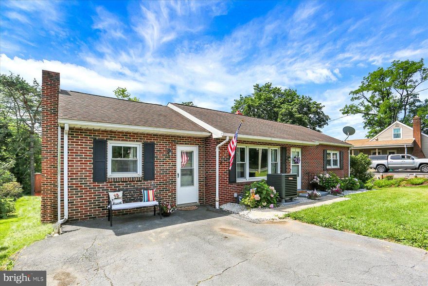 Welcome to this well-maintained 2-bedroom, 1-bathroom ranch home on almost a half acre in Enola. Offering the ease of one-level living, this home features beautiful hardwood floors and a thoughtful layout designed for comfort and functionality.

Inside, you'll find both a cozy family room and an additional living room—perfect for entertaining, relaxing, or converting into a guest space or home office with beautiful built-in shelves! The bright sunroom offers a peaceful retreat with views of the private backyard, ideal for enjoying morning coffee or evening sunsets.

The kitchen features knotted pine cabinets and a charming brick wall, adding to the character in this home. The full bathroom is ready for your personal touch. Your new home has a full walkout basement, providing ample storage and future finishing potential.

Additional highlights include a brand new heat pump for year-round comfort and energy efficiency, and new LVP flooring in the family room and sunroom.

Conveniently located just minutes from major routes, local schools, shopping, and dining—this home is the perfect blend of suburban living with easy access to everything you need.

Don’t miss this opportunity to make this inviting ranch your own—schedule a showing today!