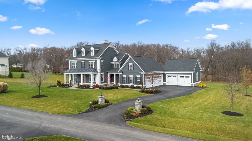 The RE/MAX Collection of Fine Homes & Luxury Properties proudly presents 12415 All Daughters Lane; a stunning Mitchell & Best custom home in the River Hill High School district. As you pull down the quiet street you’ll open one of five garage bays, turn on the interior lights, and set the temperature of the home to the perfect setting through an app on your phone. The gorgeous curved beds filled with diverse plantings, the flagstone walkway, extensive  exterior illumination system, and the bold craftsman-style architecture will welcome you back to your flawlessly designed custom estate. Each and every detail of this home has been well thought out and each component masterfully maintained. From the high-end finishes that you'll find on all three levels, to the four-season sunroom and covered rear entertainment area; the immense pride of ownership is on display throughout each feature of the home. The main level has great flow, a comfortable feel, and offers a private office, multiple living spaces, and a gorgeous transition area complete with cubbies, an additional half bath, and walk-in pantry. The kitchen stands out as the focal point of the main level with a stunning granite countertop, high-end stainless steel appliances including a commercial grade gas range, and gorgeous custom cabinetry. There’s not enough that can be said about the four season sunroom that leads to the composite deck and permanent outdoor kitchen. This room provides a cozy, bright, and well-insulated space to enjoy year round. The northeast exposure provides a stunning view of the sunrise making this the perfect location for your morning coffee while you read. The upper level features a massive primary suite, laundry room with utility sink, reading area, and three additional spacious bedrooms with two additional full bathrooms to service them. The basement is fully above grade in the rear of the home and walks out directly to the covered entertainment area complete with an outdoor television, permanent gas fire pit, and more professionally designed landscaping. The basement also offers a billiards area, wet bar, bonus bedroom, tons of storage, full bathroom, and a large media room. Excellent potential for inlaw suite, if desired! There’s nothing left to do but unpack and enjoy; this home is move-in ready from day one. Ask for our owner’s manual for makes, models, ages, and maintenance notes for each and every component of the property! **KEY FEATURES - DATES - HIGHLIGHTS** Premium lot surrounded by preservation parcels ($50,000 lot premium) - 1.14 Acres of flat/cleared space - 4 Season sunroom w/ heating/cooling - Covered outdoor entertainment area w/ permanent gas firepit and outdoor kitchen (Over $225,000 of features added) - NGBS Green Certified Home - Composite deck - Hardie Plank siding - Architectural shingle roof - Exterior illumination system w/ 2,000+ color schemes controlled through app - Full yard/landscaping irrigation system controlled through app - Built-in shed/outdoor storage - 5 car garage w/ space for workshop - Garage car detailing vacuum/station - Flagstone walkway/porch - Stone accents around foundation - Asphalt driveway - Tri-zone HVAC w/ 2 gas furnaces & mini split - HVAC steam humidifier - Large mudroom/transition area w/ cubbies - Walk-in pantry - Gourmet kitchen w/ gas range & stainless steel appliances - 3 Additional beverage fridges - Variable width wood floor - Wet bar in basement - Stunning crown molding, tray ceilings, and coffered ceiling - Chair rail molding - Gas fireplace w/ stone hearth/surround - High ceilings on all 3 levels - Butler's pantry w/ bev storage & coffee bar - Upper level laundry - Massive primary closet - Soaking tub & seated shower w/ glass door in primary - Exterior drainage system - Space for pool/sports courts - Local attractions include the River Hill Village Center, Maple Lawn Shopping District, Cattail Creek Country Club, The Merriweather District & Old Ellicott City.