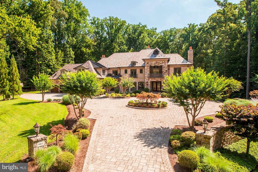 Incredible custom home offers nearly 14,000 SF of luxury living space on 2 private acres backing to serene parkland! Six Bedroom Suites each have their own Bathrooms, including Master Steam Shower, Bubble Tub, w/ His & Her Walk-In Closets and Water Closets, convenient laundry. Dramatic Two-Story Foyer and Living Room offer tons of natural light and gorgeous spiral staircase to the upper level. Top-of-the-Line Family Kitchen, Catering Kitchen, and Lower Level Bar - each with high-end Wolf/Sub-Zero appliances. LL Billiards Room, Wine Cellar, and more. Fabulous Rear Garden w/ Outdoor Kitchen. 4-Car Garage.