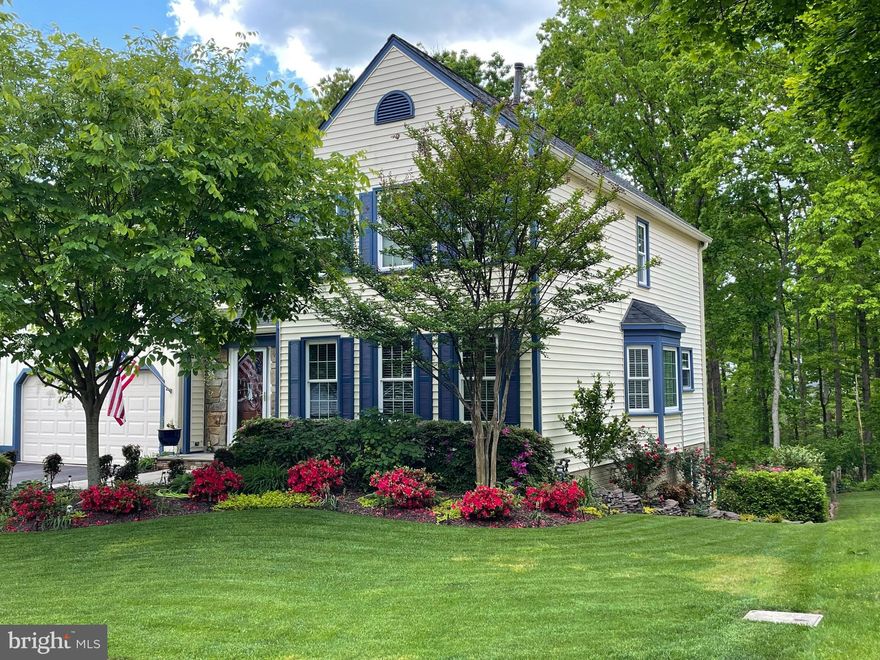 This beautifully landscaped home in the quiet neighborhood of Cherry Run,  has 3144 square feet on three levels with 5 bedrooms and 3.5 bathrooms.  The home is well-maintained and updated with light gray walls and neutral carpeting throughout.  Cherrywood cabinets and granite in the kitchen, as well as 2.5 bathrooms creates a calm symmetry throughout the home.  The eat-in kitchen abuts the two story family room with skylights, ceiling fan, and a floor-to-ceiling stone fireplace, creating a remarkable gathering place for your family.  Off the family room is an expansive deck with a pergola covered in Wisteria that overlooks the woods  were many fox and deer will be your visitors.  A wonderful retreat for entertaining.  The lower level contains a utility room with substantial storage as well as an in-law suite, bathroom with shower plus another family room.  The lower level has a walk out to the back patio and gorgeous landscaped yard.  The lower patio may also be accessed from the deck, and has a pad wired for your hot tub. Windows replaced in 2005, kitchen remodeled in 2011, Primary bath remodeled in 2015, skylights 2015, water heater 2016, roof 2018.  Six panel-doors on main level 2020, new carpet 2021 and carpet in basement 2022.  HVAC replaced 2025, gutters and leaf guards 2018.  The Cherry Run community is close to grocery stores and restaurants.  Cherry Hill elementary is 2 blocks away.  Pohick Regional Library is less than 2 miles.  Fairfax County Pkwy is very convenient to this homes location.  South Run Distric Park is less than 2 miles and includes an indoor pool, fitness ctr., racquetball, classes, soccer fields, pickleball, tennis and a playground.  Enjoy all the amenities of Burke Lake Park, golf, train, playgrounds, kayaking, fishing and more.