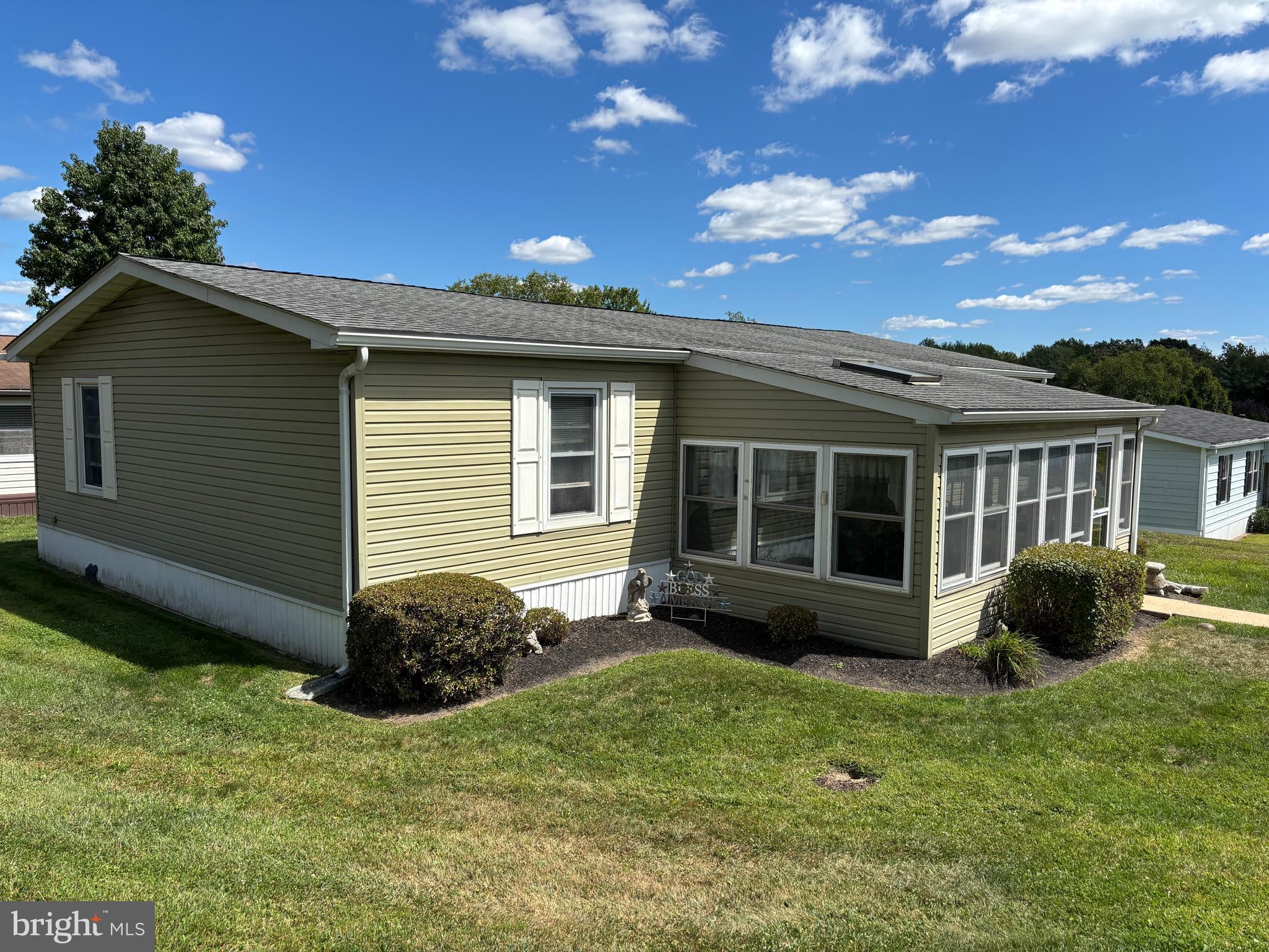 Welcome to this spacious 3-bedroom, 2-bathroom corner lot home with an enclosed porch, located in the 55+ Village of Neshaminy Falls. There is convenient parking right in front of your home, leading into a porch that features newer windows, a skylight, and a ceiling fan.
Step inside to the large living room, which boasts a bay window overlooking the porch. This area also includes a lighted ceiling fan and is open to the dining area. The dining room features a built-in china cabinet, a chandelier, and sliding glass doors that lead to an outdoor deck with an awning, perfect for entertaining.
The upgraded kitchen has newer cabinets, countertops, and appliances, along with a pendant light above the deep sink, recessed lighting, and an overhead fan. The kitchen also includes a breakfast bar, additional cabinets, and a food pantry for extra storage.
The laundry room is equipped with a washer, dryer, and stand-up freezer, alongside additional cabinetry for storage. From the kitchen, you will find the primary bedroom that includes an en suite bathroom with a shower stall. The guest bathroom has been updated to feature a walk-in tub, ideal for relaxing after a long day. Two additional bedrooms are just off the hallway and can also be used as either a den or an office. Make your appointment soon to see this wonderful home and add your finishing touches!