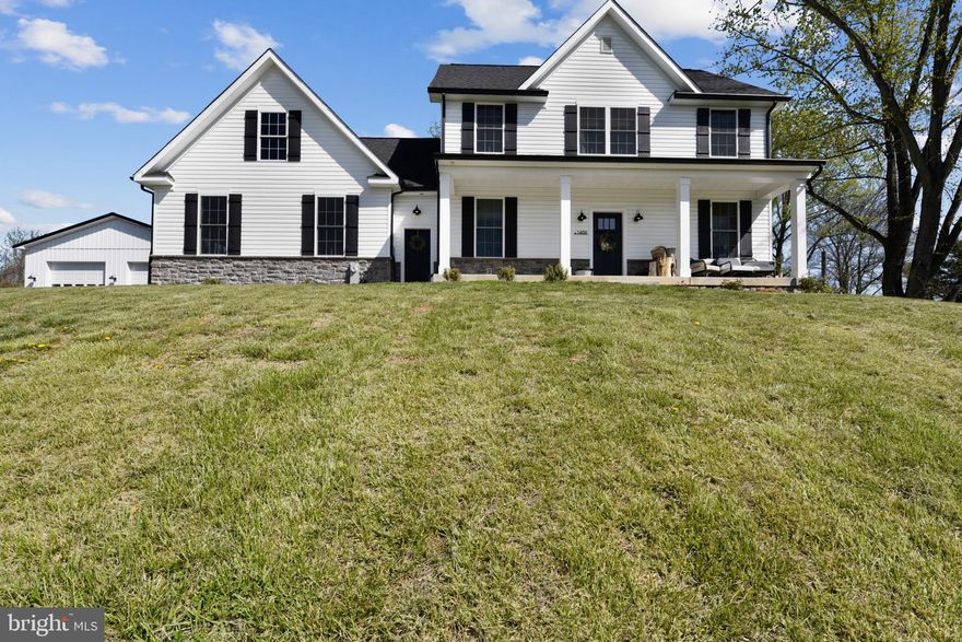 Absolutely beautiful farmhouse home located on 2 acres in Jarrettsville! Enjoy the beautiful hilltop views from the front porch. Welcoming open foyer leads to dining room,  eat in kitchen and living room with propane fueled fireplace. Amazing backyard with maintenance free deck and salt water pool that backs up to a farm.  Spacious primary bedroom with cozy electric fireplace and custom closet system. Attached bathroom with double vanity, walk in shower with separate showerheads  and private water closet. Two additional bedrooms and full bath complete the upstairs. Partially finished basement provides tons of storage with huge potential for additional living space. 30'x36’ detached shop. This won't last long! Schedule your showing today!