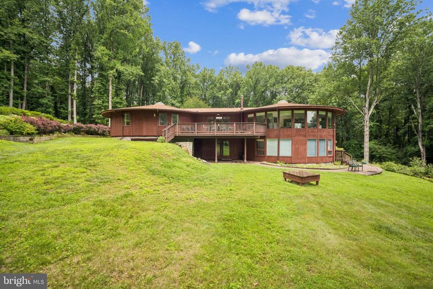 Unique, one of a kind home on over 2 acres in the heart of Great Falls used extensively for prayer and meditation. Distinct, circular architectural design in a peaceful setting. Home is being sold “as is”. Currently tenant occupied with tenant willing to stay on if new owner is buying as an investment property.  Updates include new hard wood floors in the bedroom/hallway upstairs, new HVAC unit in 2023, updated master bathroom.