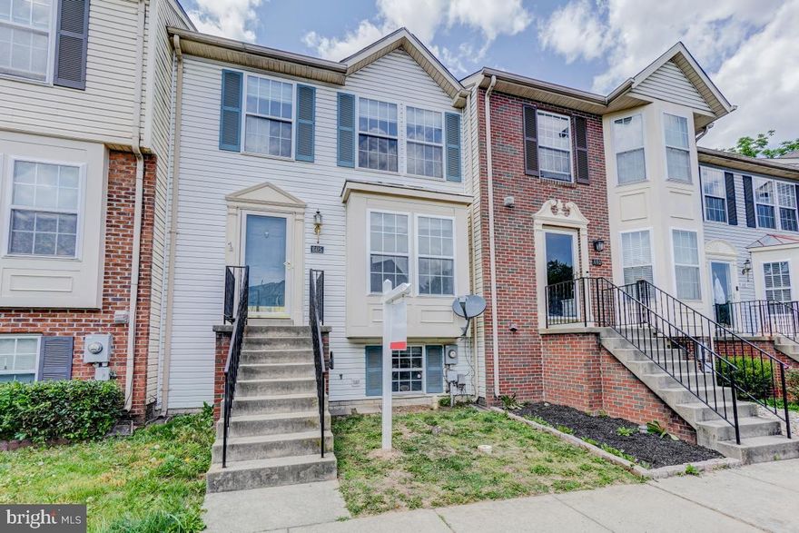 BEST VALUE & PRICE FOR MILES. ***Professional pictures coming soon.  Large 4 bedrooms 2 full and 2 half bathrooms with beautiful wood floors on main and top levels, with new paint.  Large living room and dining area with deck backing to common area. New carpet in basement with full bedroom and half bath. Walkout basement to wood patio and fenced yard. Two assigned parking in front of house. Priced for your updates.