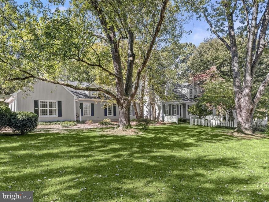 Welcome to this sprawling custom estate that blends timeless elegance with modern comfort across a versatile and thoughtfully designed floor plan. From the beautifully landscaped grounds to the oversized four-car garage, every detail of this exceptional residence has been carefully curated to offer an unparalleled living experience. Recent updates including a new roof, refreshed bathrooms, and upgraded appliances enhance its enduring appeal. 

A gracious foyer is flanked by a formal sitting room and a living room, each featuring wood-burning fireplaces, rich hardwood floors, and classic moldings. The living room also boasts custom built-in shelving, adding both character and functionality. The eat-in kitchen is a chef’s dream, complete with granite countertops, a center island with butcher block and prep sink, display cabinetry, and additional built-ins. Adjacent to the kitchen, is an expansive sunlit casual dining area with a sunken morning room that opens to the rear yard, while a arrival center provides easy access to the garage, full bath, and outdoor spaces. The inviting family room with a striking stone fireplace and a second dining room with a bay window offer ideal settings for gatherings, a dedicated media room and powder room completes the main level. 

Upstairs, the expansive primary suite serves as a true sanctuary, featuring a sitting room with a fireplace, high ceilings, a walk-in closet, built-in window seating, and a luxurious en-suite bath. Three additional bedrooms, two full bathrooms, and a conveniently located laundry room complete the upper level. The finished lower level extends the living space with a generous recreation room with walkout access to the patios, a private office, full bath, and an expansive storge area. 

Outside, the home’s charm continues with circular drive access, multiple brick paver patios perfect for entertaining, and four acres of picturesque land offering both privacy and endless possibilities. This extraordinary property seamlessly combines classic architectural details with thoughtful updates, creating a one-of-a-kind estate designed for modern living and timeless style.