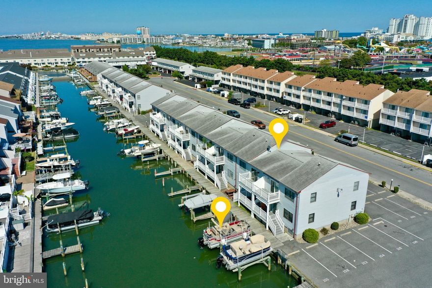 **Sea Robin Condominium -  Waterfront Retreat**  Welcome to the Sea Robin Condominium, a bright and cheerful 878 square foot beach getaway featuring 2 bedrooms and 2 baths. This beautifully maintained waterfront condo includes a deeded 8,000-pound boat lift, perfect for boating enthusiasts. The inviting waterfront balcony offers serene views down a wide lagoon, creating the perfect setting for relaxation. 2 assigned parking spots, Conveniently located just a short stroll from the world-famous Ocean City Boardwalk and many iconic attractions, this property offers excellent Airbnb income potential and is a fantastic year-round retreat. With affordable condo fees of only $1,200 per quarter and annual taxes of $2,436, this is the one you’ve been waiting for!