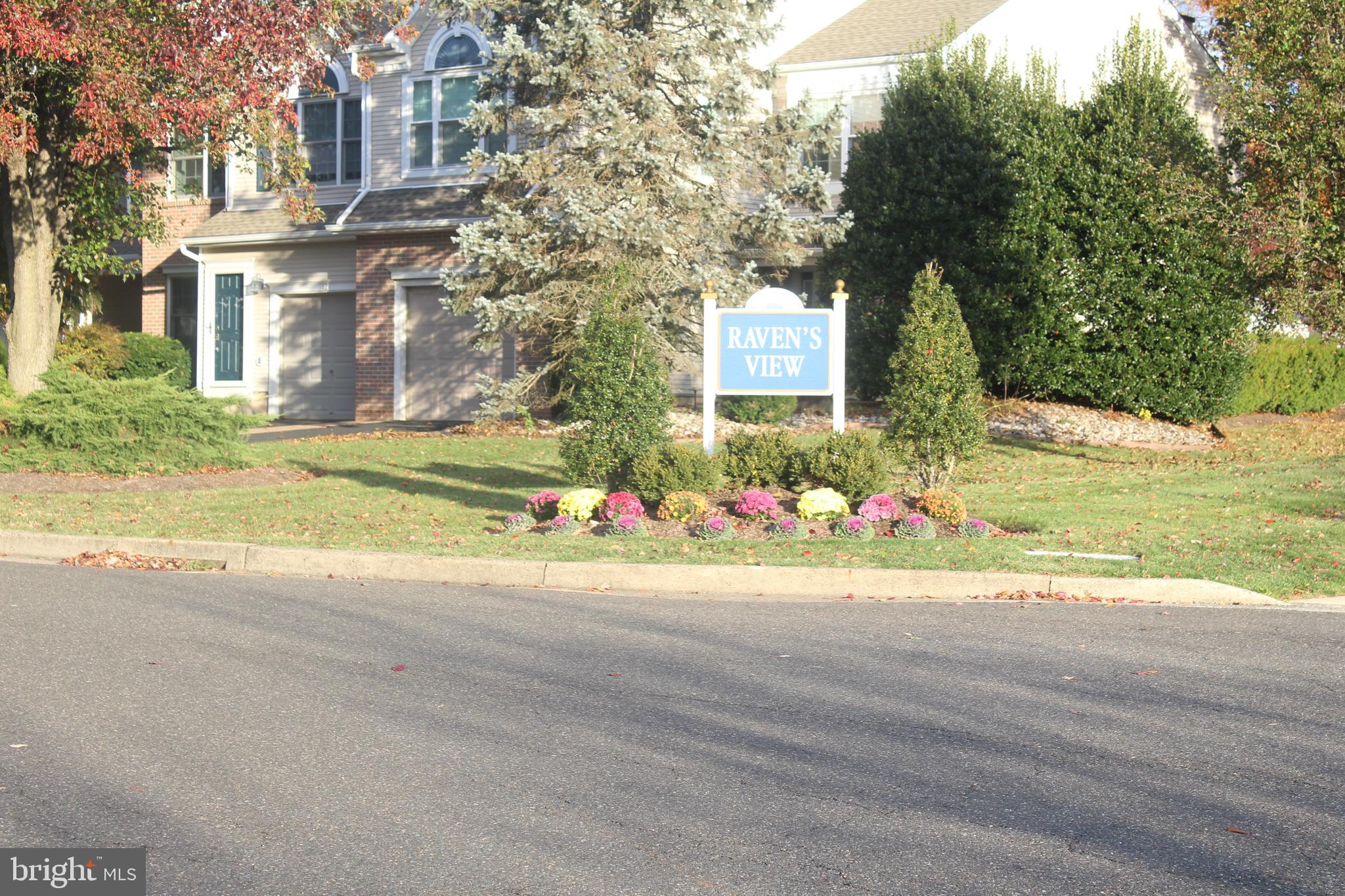 Newtown Grant, Raven's View. A wonderful community nestled in Newtown Township, Bucks County Pennsylvania. Come see this very well maintained townhome situated in a quiet cul-de-sac with lighted sidewalks that surround the community for those early morning and late afternoon walks. Walking in the front door you will be greeted by a spacious living area, separate dining room, sitting room with wood-burning fireplace and eat-in kitchen . The kitchen is equipped with stainless steel appliances, custom built coffee bar, vaulted ceiling with skylights and entry way to the back patio where you will find a large backyard with beautiful sunset views. The finished basement has plenty of room for entertaining, movies, reading, or Zen time after work. The basement includes a fourth bedroom with closet space, windows, a storge nook, and wall to wall carpet. Moving on to the upper level you will find three spacious bedrooms; The primary bedroom has a recently remodeled bathroom with an incredible walk-in shower, storage area for towels and toiletries, and a beautiful vanity. In the primary bedroom you will find a sitting/dressing room with a closet, as well as a spacious walk-in closet with attic access. Right outside the primary bedroom is a custom fitted laundry room with sink, countertops and cabinetry. The two other bedrooms are nice size rooms with spacious closets ,the main hall bath has been updated within the last month . There is access to the garage from inside the house, plenty of storage throughout the home . A community center, community pool , pickleball courts, tennis courts , walking paths and more. Minutes away from Tyler Park , restaurants , the Newtown Farmers Market, bakeries, shops and so much more . The peace and quiet of country living right outside your door . When it comes to updating the home, the sellers spared no expense. Come see for yourself , do not delay, make your appointment today .