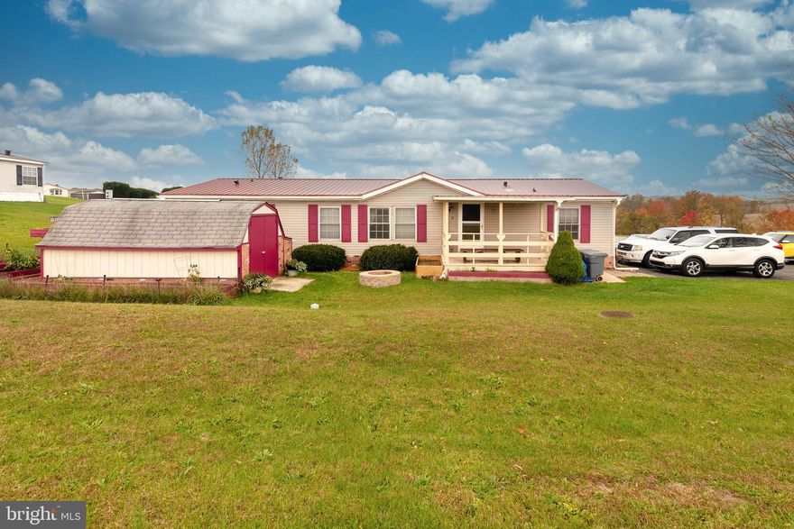 Situated on a corner lot with amazing views, this affordable 3- bedroom home is a must-see!  The upgrades are endless! This home features a newer metal roof, newer windows, gleaming hardwood floors, and mahogany doors. There is plenty of room in the kitchen to concoct your favorite meal while entertaining guests in the adjacent dining room.   The attached covered deck offers a relaxing outdoor space for unwinding after a long day.  Enjoy the countryside with the convenience of shops and businesses nearby.  Come and experience all that this home has to offer!