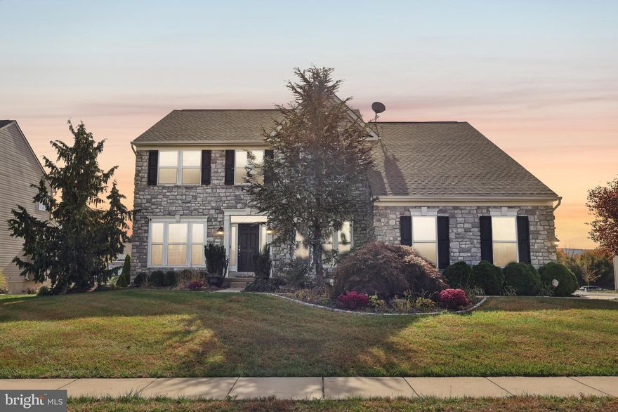 Welcome to this stunning single home, perfectly set on a lush, landscaped 0.29-acre lot that feels like it was made for memories. From the moment you arrive, there’s a sense of warmth and care—a home designed not just for living, but for truly enjoying every moment.

Step through the front door into a gracious hardwood foyer, where sunlight filters in and the split staircase sets a beautiful tone for the home. To your left, the living room—with its crown molding and soft natural light—invites quiet conversation or a cozy evening with friends. Across the hall, the dining room, framed by wainscoting, crown molding, and a tray ceiling, feels ready for holiday dinners, birthday toasts, and late-night laughter.

The heart of the home, the oversized kitchen, is every cook’s dream—featuring a large island, granite countertops, double oven, and both a butler’s and walk-in pantry. The Morning Room floods with sunlight, perfect for slow Sunday breakfasts or coffee before the day begins. Just steps away, the family room—with its elegant columns—brings everyone together, whether for movie nights or impromptu gatherings. A private office with French doors, a half bath, and a laundry room with garage access add convenience and ease to everyday living.

Upstairs, the primary suite is your sanctuary—a spacious retreat with a sitting area, double-door entry, and two walk-in closets. The ensuite bath, with its soaking tub and walk-in shower, feels like your own personal spa. The additional bedrooms are bright and welcoming: one with its own private bath and two sharing another, making it easy for everyone to have their space.

The fully finished lower level offers endless possibilities. A great room for game nights, a media room ready for movie marathons (with projector and sound system included), and a versatile bonus room for a 5th bedroom, home gym, or creative studio. A walkout slider leads you effortlessly to the backyard—private, peaceful, and surrounded by mature landscaping that creates a sense of calm.

And with no HOA, you have the freedom to make this home truly yours—whether that means a garden, a fire pit, or a place for summer barbecues.

Elegant yet comfortable, spacious yet warm—this home isn’t just a place to live, it’s a place to belong. Ready to welcome its next owners with open arms.