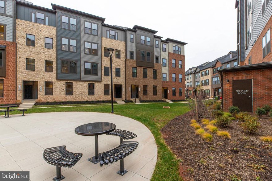 Be the first to experience luxury living in this brand-new Picasso model town-style condominium at The Ellipse at Westfields in Chantilly, a premier Fairfax County community tucked away amid green space and pocket parks, where Ryan’s largest Composer Series model combines the spaciousness and customization of single-family living with the ease of condominium ownership; the main living level showcases 8-inch LVP flooring, Oakwood stairs, and an enormous gourmet kitchen with Montclair design palette, Downing linen cabinetry, stylish backsplash, stainless steel appliance package including gas range and side-by-side refrigerator, built-in microwave and wall oven, a huge work island, pantry cabinet, and terrace, all opening to a bright, airy living room and cozy dinette that flows seamlessly into the family room, while a window-lined morning room with optional hutch provides additional dining space. The kitchen is a gourmet’s dream with a huge work island and pantry cabinet with a built-in microwave and a wall oven. The dinette is perfect for cozy dinners at home and is open to the Family Room.  ; upstairs, the elegant upper level offers three bedrooms, two baths, and laundry, highlighted by a magnificent Owner’s Suite with tray ceiling, dual walk-in closets, sitting area, and spa-inspired bath featuring oversized shower, dual vanities, compartmentalized water closet, and shower with seat, complemented by generous secondary bedrooms with ample closets and a hall bath with double bowl vanity; this home includes transitional trim, recessed lighting, a one-car garage .  Abundant visitor parking, and a 1-year builder’s comprehensive warranty, all within minutes of shopping, dining, metro stops, and major commuter routes including 28, 50, 267, and I-66—an exceptional opportunity not to be missed!