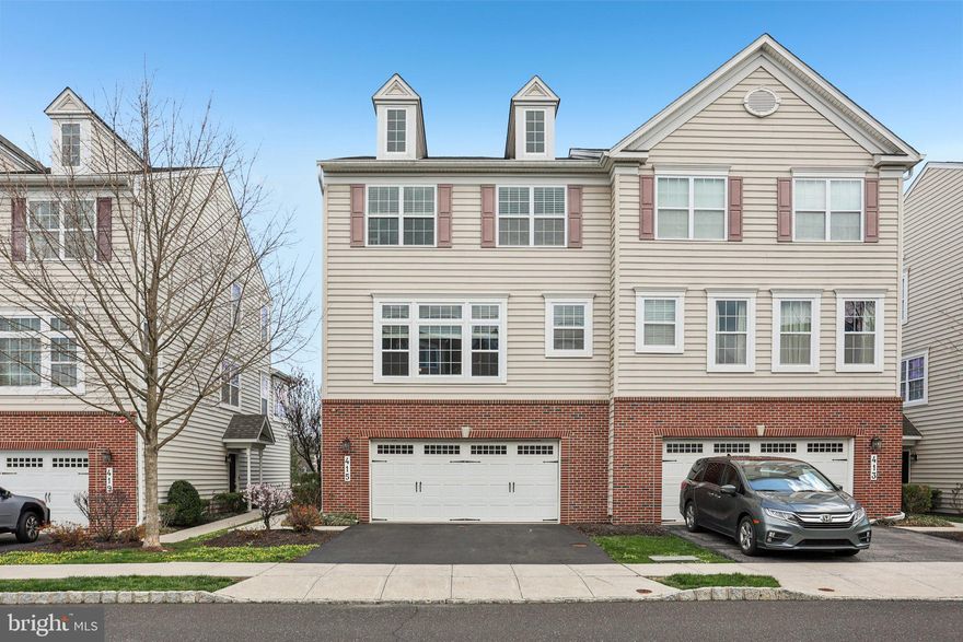 Welcome to one of the most desirable townhouses in Lansdale’s, Williamson Square Community in the North Penn School District!  Built in 2013, this rare three-story end-unit offers a larger floor plan than its neighbors, and is flooded with natural light from three sides. Walk through the private side entrance into a versatile lower level. This expansive space—perfect for a home office or media room—leads directly to your quiet lower-level patio. You'll also find interior access to a spacious two-car garage, complete with custom shelving included in the sale. The second floor is the heart of the home. The open-concept design seamlessly connects a sunny living room with a cozy gas fireplace to the gourmet kitchen. Chefs will love the granite countertops, striking wood cabinetry, and center island. Enjoy morning coffee in the breakfast nook or the adjacent sunroom, which offers views of 4th Street Park. Step through the sliding-glass door onto your private 10’ x 12’ deck for seamless indoor-outdoor entertaining. Upstairs, the primary suite features a large walk-in closet and a spacious bath with double sink vanities and a large stall shower. Two additional bright bedrooms, a full hall bath with a tub, and a dedicated laundry area complete this level.  It doesn't get better than this. A walkable location, neighborhood sidewalks, adjacent to the 4th Street Park, less than a mile from the dining, and shops of Main Street, and the SEPTA station. Enjoy the local hotspots, Lansdale Farmers Market and active community events.