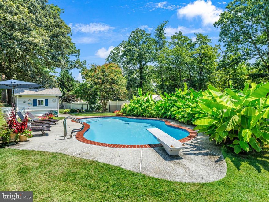 This spacious five-bedroom, two-and-a-half-bathroom home offers comfort, function, and seasonal fun all wrapped into one. With over 4,000 square feet of interior living space, there’s room for everyone—plus the in-laws, if you’re feeling generous. An open floorplan welcomes you into the heart of the home, where hardwood floors flow throughout common areas, making it easy to move from room to room without missing a beat. The whole home was remodeled and additions added in 2002 with the master bath remodeled in 2024. With a marina a few hundred yards down the road you could be walking distance down from the boat and the community beach offers opportunity for fishing and swimming and enjoying the river!
 
The kitchen and main living spaces blend seamlessly, perfect for both weeknight dinners and weekend gatherings. Need to work from home (or just need a break from everyone else)? There’s a dedicated office ready to bring out your inner focus.

Step outside and discover a backyard designed for relaxing and entertaining. Enjoy warm evenings on a large deck featuring a built-in hot tub, a charming pergola and plenty of space to entertain. Just a few more steps lead you to your beautiful in-ground pool. There’s also a shed out back for all your storage needs and a paver driveway out front that adds both functionality and curb appeal.

The primary bedroom gives you a quiet retreat, and water access nearby adds one more excuse to spend your weekends outdoors. Whether you're soaking in the tub, sunbathing by the pool, or watching the sunset from the deck, this home lets you do it all without leaving your backyard. The pool was replastered in 2023. The yard extends past the pool fence to the wooden fence which includes the storage shed in the back of the property,

With 2 large storage rooms and a work shop in the basement, You will have plenty of storage room for all of the holiday decorations, extra items and your hobbies to fit!