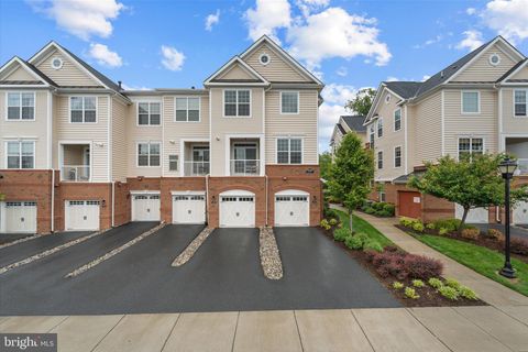 Photo of 23265 Milltown Knoll Square #114, ASHBURN, VA 20148 (MLS # VALO2124486)