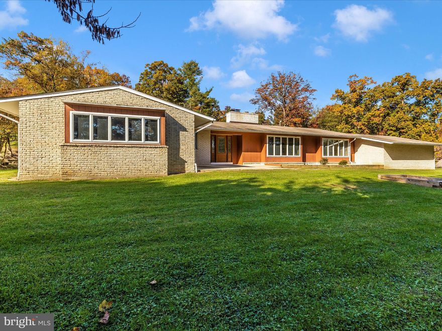 **ESTATE SALE** Great opportunity to buy this mid century modern inspired and deceptively LARGE home on 5-1/2 gorgeous acres with a stream and barn in upper Montgomery County's beautiful Ag Reserve, 5 minutes outside of Clarksburg. Perfect property for some animals, a small crop operation . . . keep the property in agricultural use to preserve tax benefits, but so many potential uses in the AR zone (see permitted uses table in the disclosures). The home is beautifully sited high on a knoll overlooking the pastures and well away from the road. The paved driveway meanders beautifully up the hill, along a line of trees and past the barn and to a wide open parking area with an oversized 2-car carport. The home has 4 bedrooms, 2.5 baths on the 2900 square foot MAIN level and amazing potential on fully finished lower level with full bath & partial kitchen.  Enormous bedrooms & baths, great room with vaulted ceiling and HUGE double-sided fireplace, family room with lots of space, gorgeous stone front fireplace and sliding door exit to grounds and pool area.  Lots of closet space; kitchen is HUGE with stainless appliances including double oven, microwave and dishwasher.  Barn has two levels with a hay loft up top. Main level has an equipment area, tack room, space for two stalls and lots of storage. Covered tractor/machine area behind the barn. This is an ESTATE SALE.  The property is offered at appraised value and will be sold strictly AS-IS.  House is clean and all systems are functioning, including in-ground pool, but house needs updating.  Buyer should budget for new paint, new carpet, update the baths, renovate or remove the lower level kitchen & bath, roof has no known leaks or issues but is on the older side.  Pool functions beautifully but pool deck needs cosmetic work  Recent inspections available on septic & HVAC are available in the disclosures.  Move in today and build sweat equity as you update this former GEM of a home or turn this beautiful property into the farmette, you've always dreamed of.  This home is away from it all and close to everything — with easy access to I-270, shopping, the outlets, Urbana, Frederick or points down county.  Showings by appointment only -- no drive-ups please. Video surveillance 24/7.  Offers must contain AS-IS language.  Quick settlement preferred.  Agents: please use MAR CONTRACT