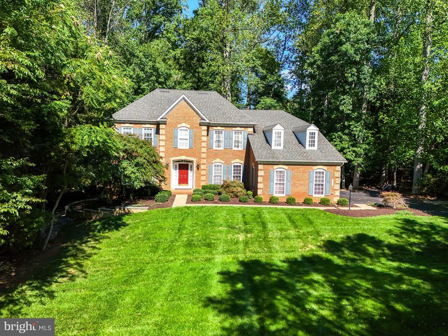 Back on the Market! Buyers got cold feet. Executive Kingsmill model by NV Homes in Brookside! The moment you enter the 2-story foyer with custom tiles and dual closets you'll appreciate the well thought out floor plan consisting of private, formal rooms, and open informal living spaces.  A large 2-story  family room featuring a gorgeous stone fireplace, flows effortlessly into the light filled morning room overlooking the wooded rear yard, and into the expanded kitchen with upgraded Stainless Steel Bosch appliances, and a multitude of beautiful hickory cabinets.  So much counter space! Complete with a wrap around peninsula, including breakfast bar seating, and a large center island. Granite counters and a custom backsplash set the stage for culinary delights! Entertaining will be a breeze with the Butler's panty leading into the elegant formal dining area. A formal Living room and a Study round out this wonderful main floor layout. Upstairs you will find a primary suite with a large walk-in closet, and expanded primary bathroom with soaking tub, seamless shower, and dual sinks. You will also find a "princess suite" guest room with it's own built in bathroom, and 2 additional rooms sharing a "jack & jill" bathroom.  Enjoy the seclusion of the wooded rear yard from your expansive, tiered Trex deck that spans the rear plan of the home and leads down to a private stone patio. The unfinished walk-out basement has plenty of room to build your dream space, or use as a wood shop/hobbyist lair! Freshly painted throughout with custom color. Large 3 car, oversized garage! Dual zoned HVAC, upper unit replaced in 2023, lower unit replaced in 2020, Water Heater 2013. Air Ducts cleaned 2023. The front lawn of this home features fig trees, and the rear yard features a splendid, rare registered American Chestnut Tree. Community amenities include walking trails, community pools, lakes, dock/pier, tot-lot, basketball courts, tennis courts, fitness room, community room, and more!