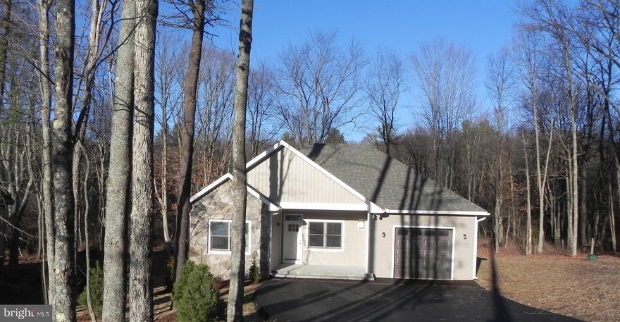 Private Charming Craftsman at Deep Creek Lake! This 3bed 2bath cottage sits on almost 2 Acres of wooded private land and features vaulted ceilings, exterior field-stone accents, and engineered hardwoods throughout. Attached heated garage with paved driveway. Front and Back outdoor living space and fire-pit. Tiled shower in the primary suite with ceramic floors in all bathrooms. Open concept living with stacked stone fireplace and modern gourmet kitchen equipped with stainless appliances and granite tops. Recently completed, this cozy modern house is just waiting for your personal touches to make it a home. Call today for your private showing!