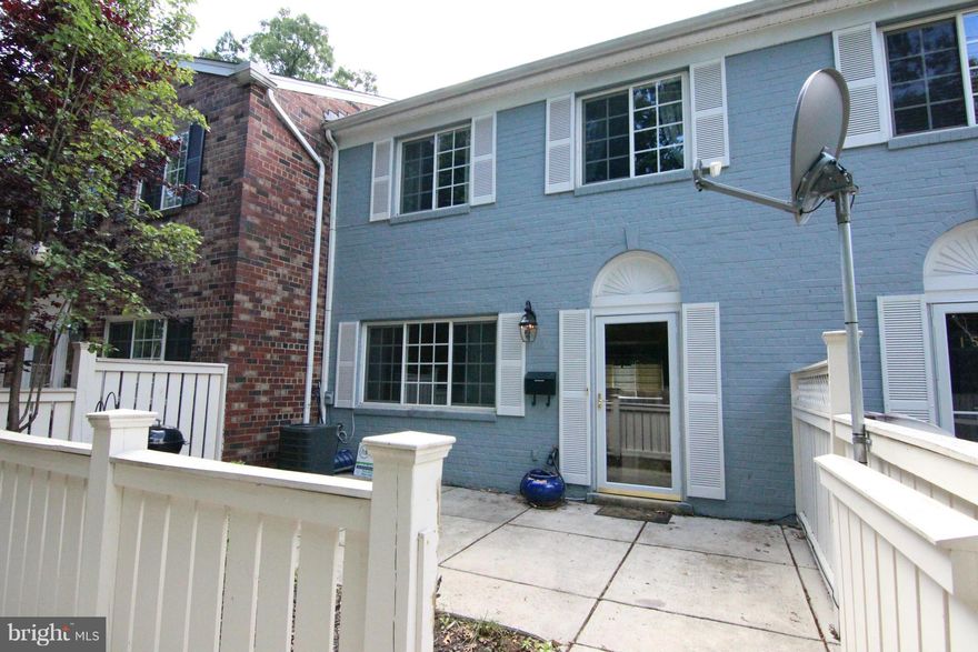 Bright & spacious w/ hardwood, crown molding, granite & newer W/D.  Large pantry in kit. 1/2 bath on main lvl w/ tile.  Master has en-suite bath w/ tile. 2nd upper bath has granite & tile.  Fenced patio great for grilling & relaxing. Quiet location & close to tot lot, pool & parking. On-site gym & clubhouse.  Metro & Dash bus stops outside of community &  2 miles to Van Dorn metro. Pets considered