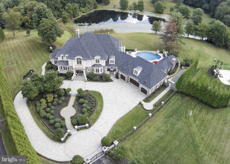 Spectacular views of pond and rolling hills * Stately custom built home has gated entrance with circular drive * For the most discerning buyer wanting attention to detail * Quality shows throughout this beautiful home with high end amenities and exquisite decorator touches * Infinity pool flanked by an expansive terrace and pool cabana area with covered outdoor living room, kitchen & large spa