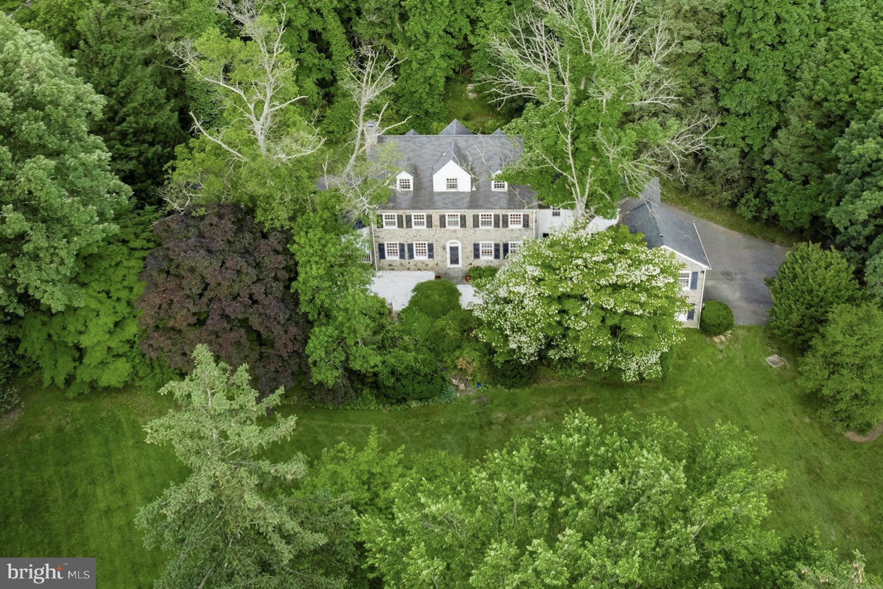 Established in 1851, this Villanova Estate’s grounds were inspired by the neighboring Chanticleer Gardens. At this point in history the influence of Quaker beliefs held by William Penn and many early founders in the area, spoke to the importance of gardens as a natural extension of a home. They provide a place for reflection, admiration of nature, and an ideal arena for entertaining. With this in mind, this home was built on nearly two acres of land, with the home positioned to overlook the sprawling gardens.
This stunning stone home reflects the elegance of the era, featuring a magnificent staircase, elegant formal living and dining rooms, and elevated moldings and millwork throughout. Double French doors provide access to a covered patio located off of the formal living room and one can step through the Dutch Door to a rear terrace that looks upon the garden and pool. The formal rooms on the primary floor are accentuated by a series of beautiful arched doorways that lead to the kitchen and family room. Upstairs, six bedrooms and three full bathrooms span over two floors, including a primary suite with a walk-in closet and en suite bathroom.
This property is special. There are few left that hold the original oversized private acreage and are minutes from the Wayne Historic District, Chanticleer Garden, Radnor Trail, Radnor Valley Country Club, and Villanova University.
This home is looking for a steward who appreciates the historic grandeur of the historic Main Line. Come make this piece of history your own!