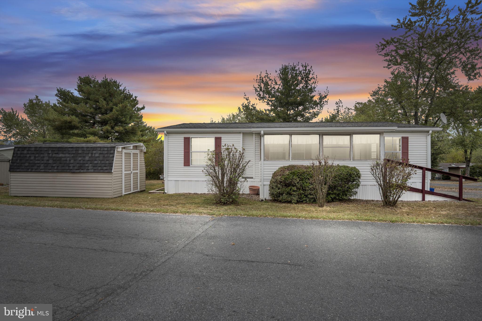 Welcome to this beautifully maintained 3 bed, 2-bath double-wide located in a friendly community perfectly situated between Carlisle and Mechanicsburg. This home offers peaceful living with quick access to shopping, restaurants, and outdoor recreation.
The spacious layout features an eat-in kitchen, bright living room, and a primary suite with a walk-in closet and a private bath. The home has been thoughtfully refreshed and is truly move-in ready, with ALL FURNITURE included if desired.
Enjoy outdoor living with both a porch and screened-in porch, plus a large storage shed and two-car driveway. The community offers two playgrounds and easy access to the Appalachian Trail and Conodoguinet Creek for outdoor adventures.
Located in Cumberland Valley School District. 3 bedrooms, 2 bathrooms, 1,054 square feet. Two-car driveway, spacious shed, screened porch.
This home is priced to bring your dream of homeownership to life. Schedule your showing today.
