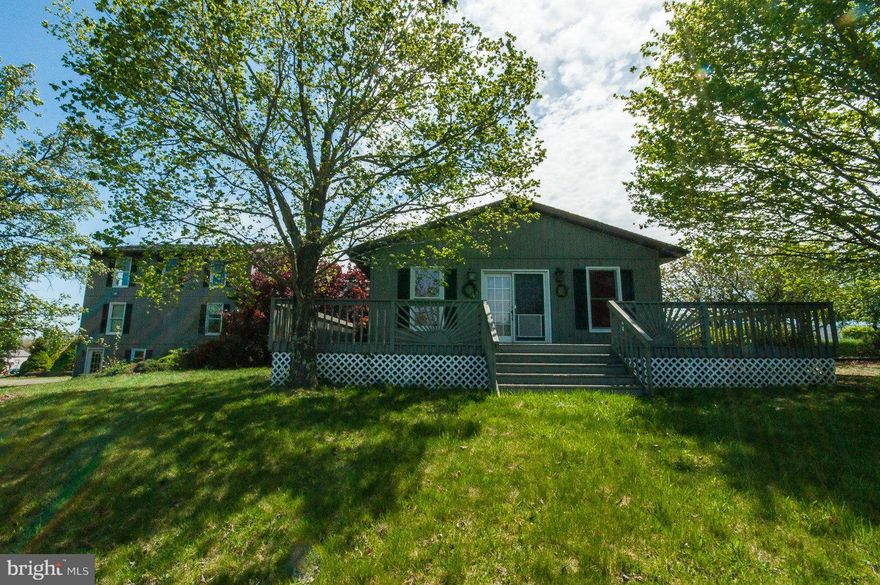 SPRING SALE! Pastoral+Mt. views  from this spacious house on UNRESTRICTED 24.39AC. Listed as 2 BR but, w/ some creative remodeling, this home has space for many more bedrooms. Home features large rooms w/ hw floors, tile baths jetted tubs+2 WB FP+gas FP+ over sized garage+cover patio+wraparound decks+inground pool+guest house for over flow guest or income producing, Purchaser to pay doc stamps