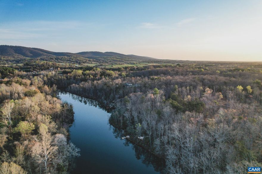 This is an extremely rare opportunity to own over 42 acres in Keswick, Virginia. This property's coveted location combined with it's seclusion is unmatched. The land boasts multiple, beautiful building sites and private lake access with more than 1,300 ft of private lake frontage. A well maintained trail network winds throughout the property, leading you to an elevated observation area plus a private dock on the water, where you can canoe, kayak, fish, or even take a ride across the lake and eat at the Clifton if you desired. There are multiple soil tests and architectural/topographical home site design studies on file. Utilities are available including high speed fiber optic internet and increased power supply from Dominion. The property has a conservation easement in place to protect the land and natural beauty, and it does allow for primary residences and multiple accessory buildings. Owning this amount of acreage in Keswick with private water access and privacy is an incredible opportunity. Private road frontage with boarded fence lines and multiple gated entrances. Only minutes from the renown Keswick Hall, Charlottesville, and HWY 64, giving you a prime location that can conveniently access Richmond or Washington DC as well.,42 Acres in Keswick on Private Lake