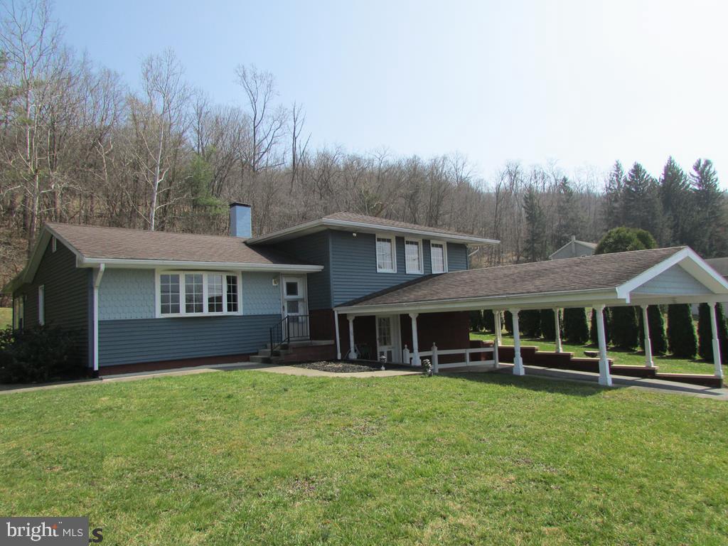 Spacious home with views of the river looking for the buyer to envision the homes full potential. The well-built house features four levels of living space with a master suite on the first level with separate entrance. Large living room and office have hardwood floors. The kitchen, dining and family room is a great place for the family to spend quality time. Two bedrooms upstairs also with hardwood floors. The large lower level can be a game room or media room. The home is equipped with an elevator that reaches all 4 levels and a generator for back-up power. Home has gas heat and central air conditioning plus fixed windows in most of the home. Lots of potential to add your personal style. Call to make your appointment today!