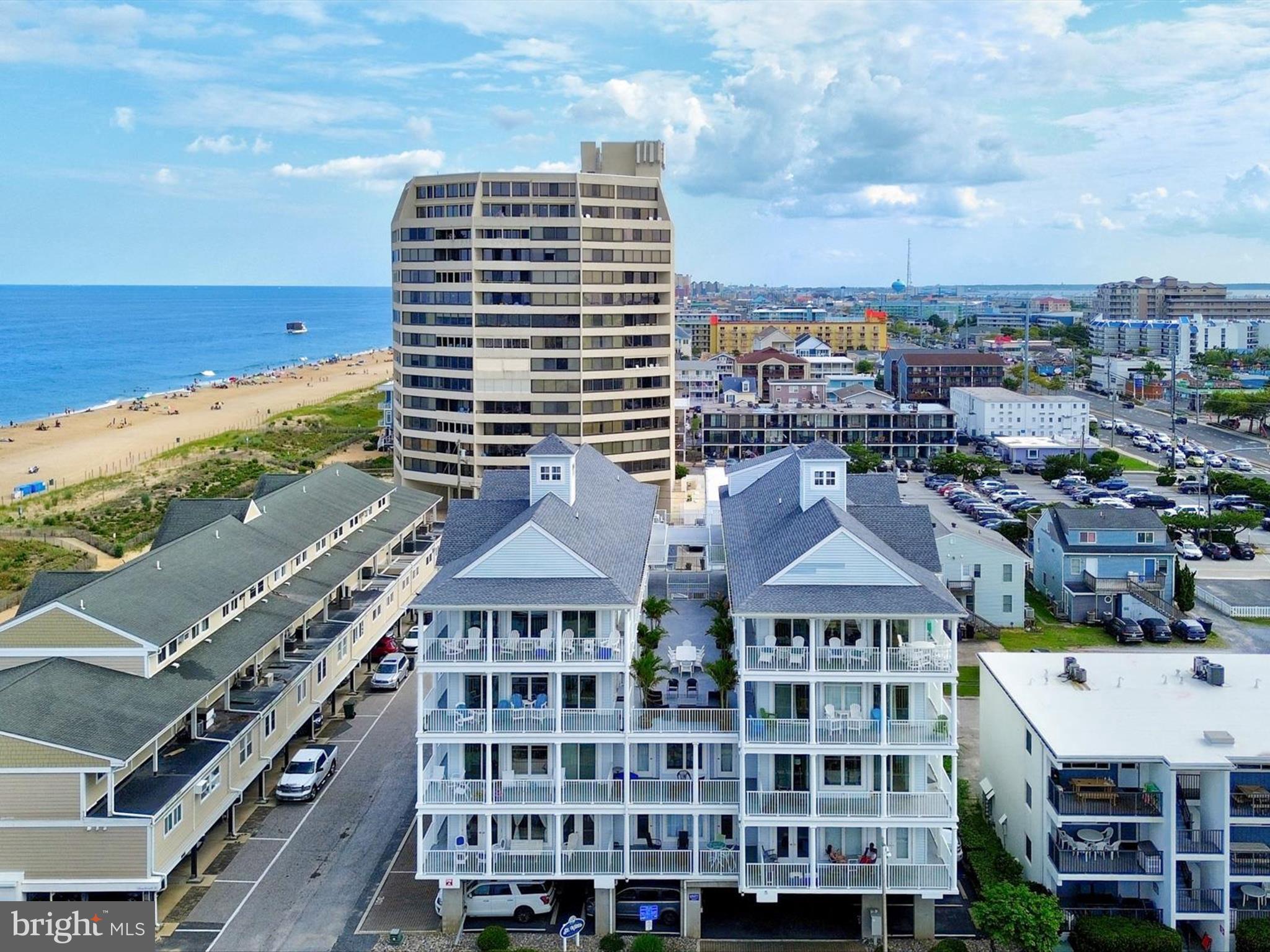 Unique opportunity to own 2 units in the rarely available St. Kitts building fittingly named "Sunrise" & "Sunset." Each spacious unit has 5 bedrooms and 4.5 baths, new HVAC units, newly replaced sliding doors, and surround sound featured in the open living areas as well as wrap around balconies with views of the beach, Atlantic Ocean & Assawoman Bay. The condos have 6 covered assigned spaces, 3 per unit, for no hassle parking and a building elevator for ease of trips to and from the beach. "Sunrise" Unit 303, has been an occasional summer retreat for the current owners and is approximately 2622 sq. ft. and will convey with most furniture. The Gourmet kitchen features granite counters, plenteous kitchen cabinets , built in wine cooler & icemaker, the granite island conveniently offers a cooktop & vented stainless steel range hood so you can prepare a feast while socializing with your guests. The living area has aesthetically pleasing cork flooring, sliding doors and windows galore allowing an abundant of natural sunlight with views of the ocean. "Sunset" Unit 301, at 2722 sq ft, is a proven high income producing rental that is being offered turn key/ fully furnished so all you have to do it start collecting the rental income. Sunset also features LVP flooring, granite counters & island, tray ceilings as well as sliders and windows galore. In between the twin units sits a beautifully decorated terrace perfect for entertaining and or family gatherings. This is an incredible offering to allow large families or great travel friends to own together in one of the most desirable garden style condo buildings in town or an incredible investment opportunity that could bring in over $280+- in gross rental income per year. Or you may just want to keep one for personal use and rent the other, either way this is an opportunity that doesn't come around often and will not be around for long!