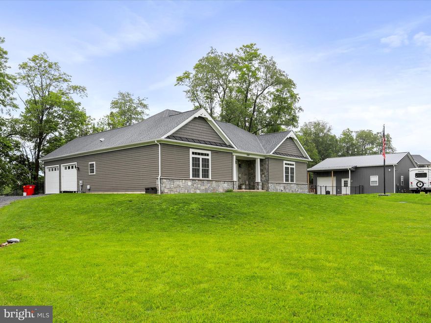 Must see!! Gorgeous well kept rancher on full basement! 3BR 2BA open floor plan with engineered hardwood. Features upgraded kitchen with build in bar area. Family room with fireplace, ceiling fans.  Primary bedroom with walk in closets, full bath w/separate tub/shower. Oversized 2 car garage attached. Rear covered deck with large fenced  area and hot tub. (gazebo & hot tub  conveys). Newly built Timberline Shop 36x36 w/covered porch, 6ft apron in rear with gravel driveway, finished concrete floor, 1 mandoor, 1 8x9 manual rolling door, 2-10x10 doors, 6 windows, ceiling fans, RV hookup, electric and water inside and outside.