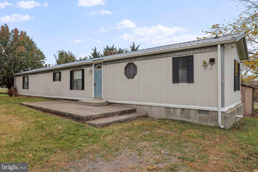 Nice 3 bedroom, 2 full bath single-wide mobile home located in rural Hancock. Situated on 1.26 acres. Traditional floor plan. Living room with built-in shelves. Eat-in kitchen with ample cabinetry and table space. Dining room with sliding glass doors to backyard deck. Primary bedroom with en suite. Central cooling and heating. Great one-level living in a countryside setting. Schedule your tour today!