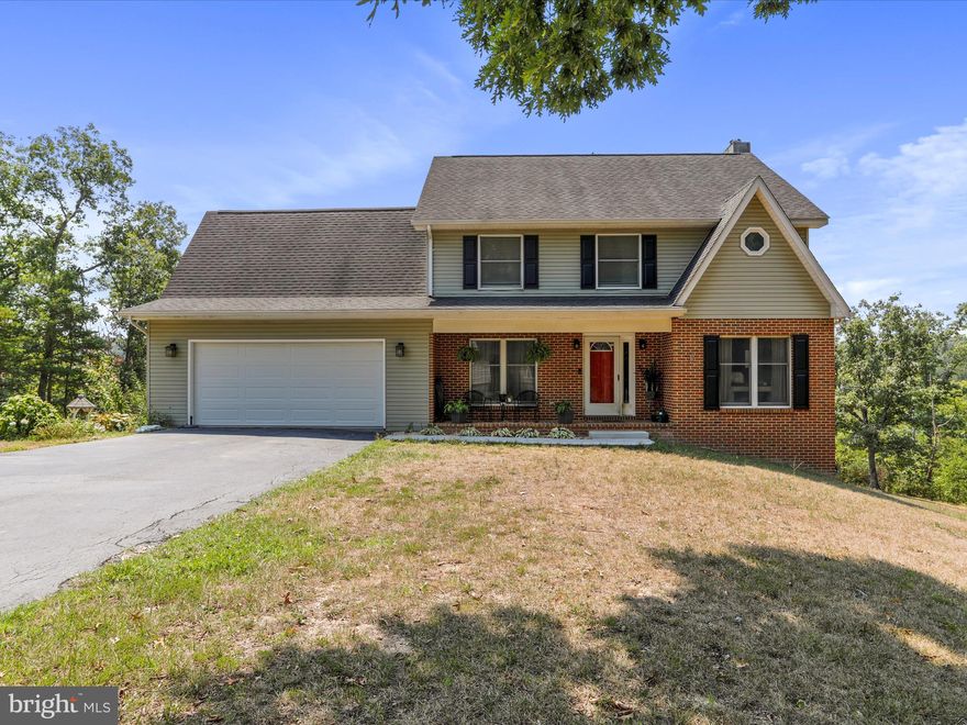 Escape the hustle and bustle of Northern Virginia and step into your dream country home in Capon Bridge, WV. This idyllic Colonial-style residence offers over 3,200 sq. ft. of spacious living on a private 6.68-acre lot at the end of a peaceful cul-de-sac. Featuring 4 bedrooms and 3.5 bathrooms, this home perfectly blends comfort and privacy, making it ideal for families or anyone seeking a serene retreat. As you enter, you’ll be welcomed by a beautifully designed interior that exudes warmth and charm. With ample living space, the home offers a partially finished full basement, perfect for a recreation room, home office, or extra storage. Enjoy your mornings on the charming front porch and evenings on the expansive rear deck, ideal for relaxing or entertaining while taking in the tranquil views of the surrounding countryside. For those with storage needs, this property includes a 2-car attached garage and a 1-car detached garage, providing plenty of space for vehicles and equipment. Additionally, the property features a 1,200 sq. ft. barn, previously used for horses, which offers versatility for storage or creative repurposing, whether for recreation or additional storage. Situated just a stone’s throw from the Virginia border, this home combines the tranquility of Hampshire County, WV, with the convenience of being only 20 minutes from Winchester, VA. Enjoy the best of both worlds with easy access to urban amenities while savoring the serenity of country living. Whether you're looking to downsize from city life or upsize for more space, this charming country residence offers a perfect blend of comfort and location. Skip the rental, skip the townhouse, and embrace a new lifestyle in this exceptional home. Don’t miss your chance to make this dream property your own.