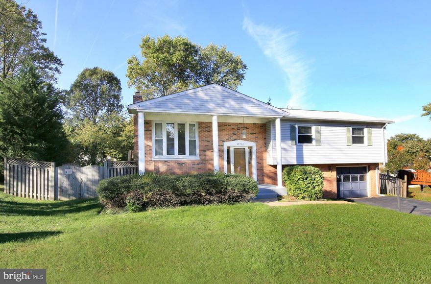 Lovely, spacious light filled home w/ eat in kitchen, updated bathrms, huge rec room w/ fireplace & mantle, new carpet, good sized bedrms. Crown molding. Deck off kitchen. Lots of good living space.  Fenced in yard, at end of cul de sac. Major updates inc HVAC,water heater, roof, w/ in last 5 yrs. Home Warranty inc when you use Cardinal Title. Immediate occupancy. Near shopping,services.