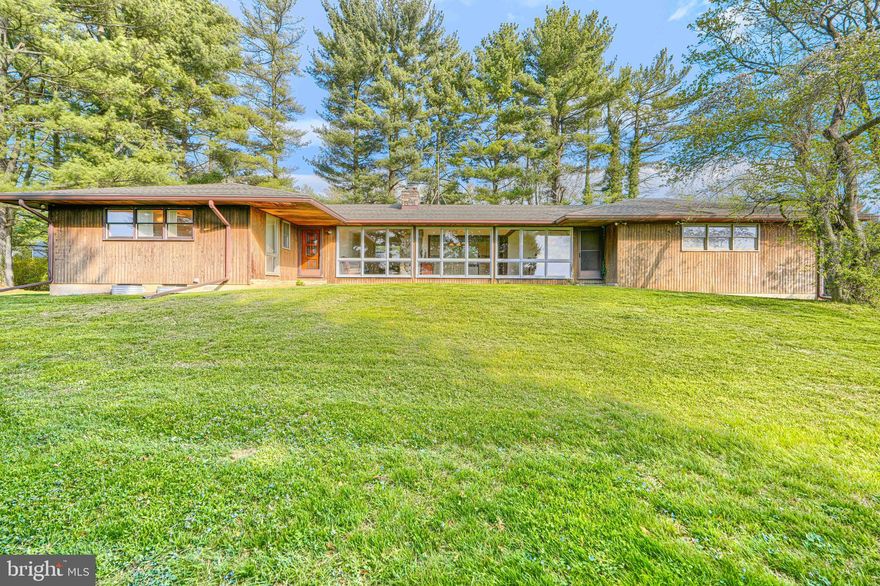 Coming Soon!  Professional photos will be available on Wed, April 15th.   Rustic charm meets mid century modern!  Welcome to this custom built rancher situated on a picturesque 1 acre lot, offering breathtaking panoramic views and unforgettable sunsets.  Located just over the  Harford County side of Monkton, enjoy the close proximity to Ladew Gardens, The Manor Races and scenic horse farms.    
This home features over 3100 sq ft of finished living space over 2 levels.  The home is being sold AS-IS and priced accordingly, based on the need for updates.  The main level floor plan offers an open kitchen, living and dining room area with a wall of windows flanking the entire rear of the home- offering sunlight and incredible views.  The home features hardwood flooring and a beautiful raised hearth stone fireplace, with easy access from this area to the flagstone patio.  There are 3 bedrooms and 2 1/2 baths on the main level.  The fully finished lower level spans the entire footprint of the home and includes two additional fireplaces—bringing the total to 3 throughout the home. The lower level is divided into a spacious rec room with interior access on one side.  The other section is accessed from the exterior and offers separate living quarters ,ideal for an in-law suite or income-producing opportunity.  Amenities include a kitchen, living area with fireplace, bedroom (possibly 2), and full bath.  An attached & oversized 2 car garage is ideal for storage.